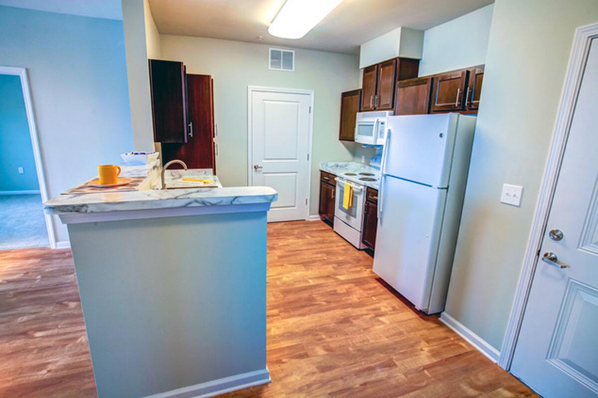 a kitchen with a wood floor