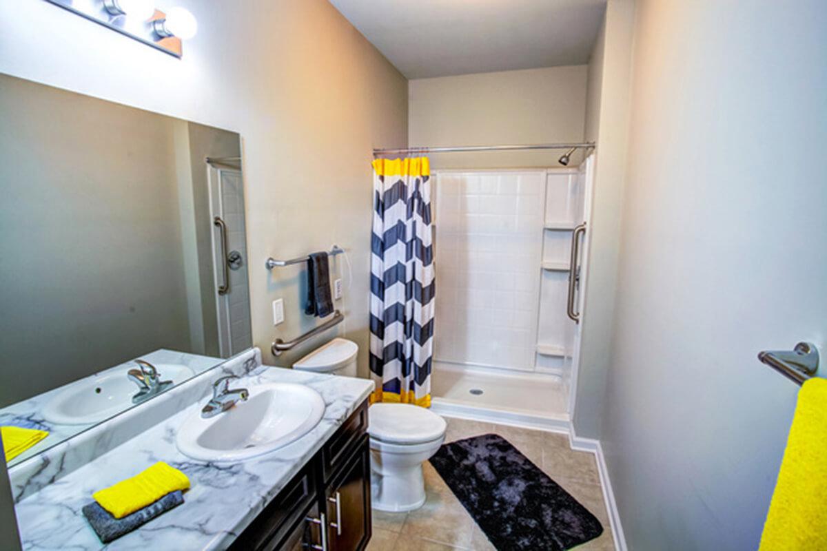 a kitchen with a sink and a mirror