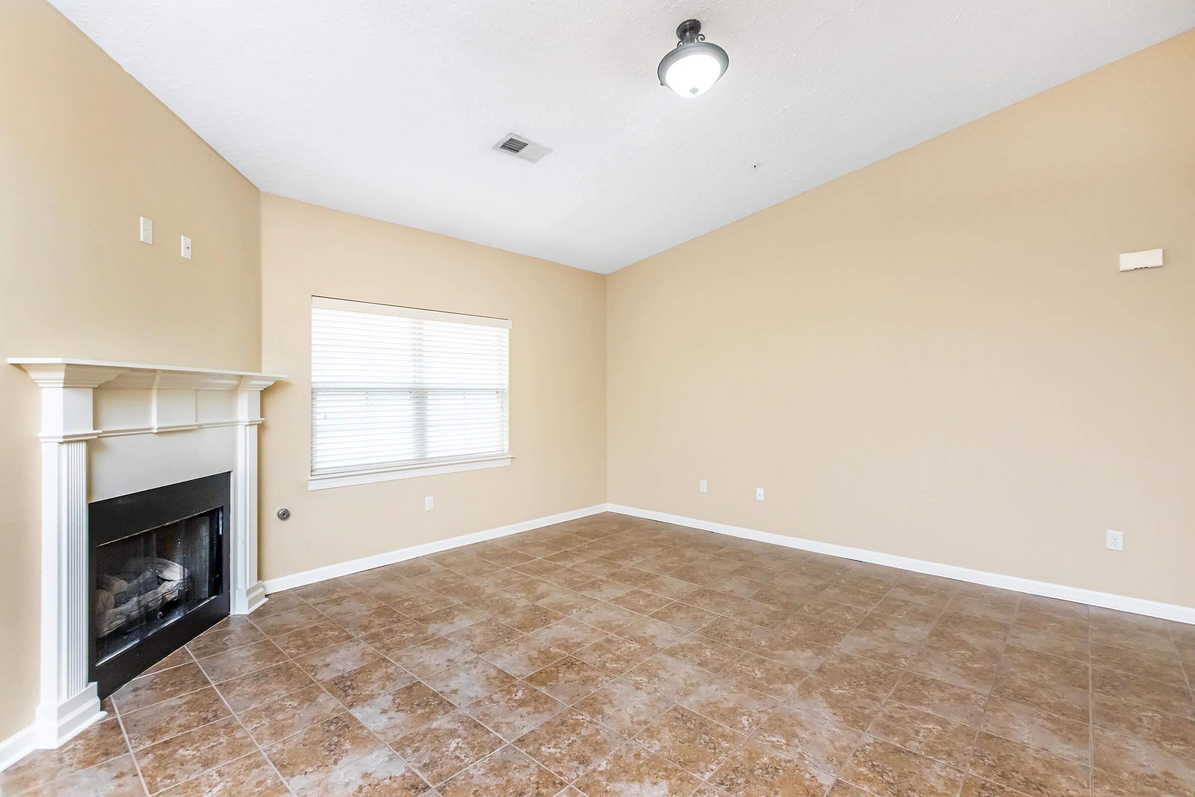 Living room with fireplace in Jackson, TN