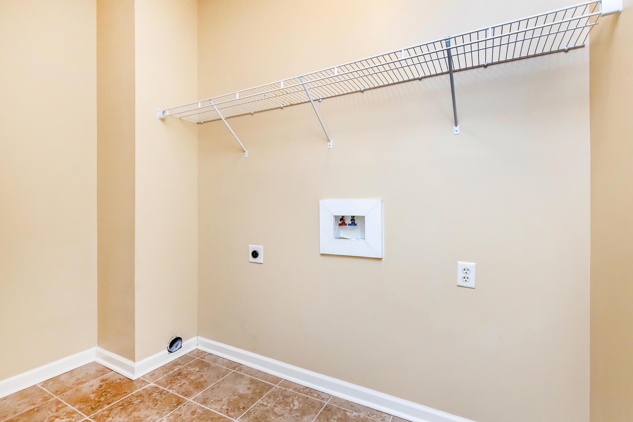 washer and dryer connections with shelving