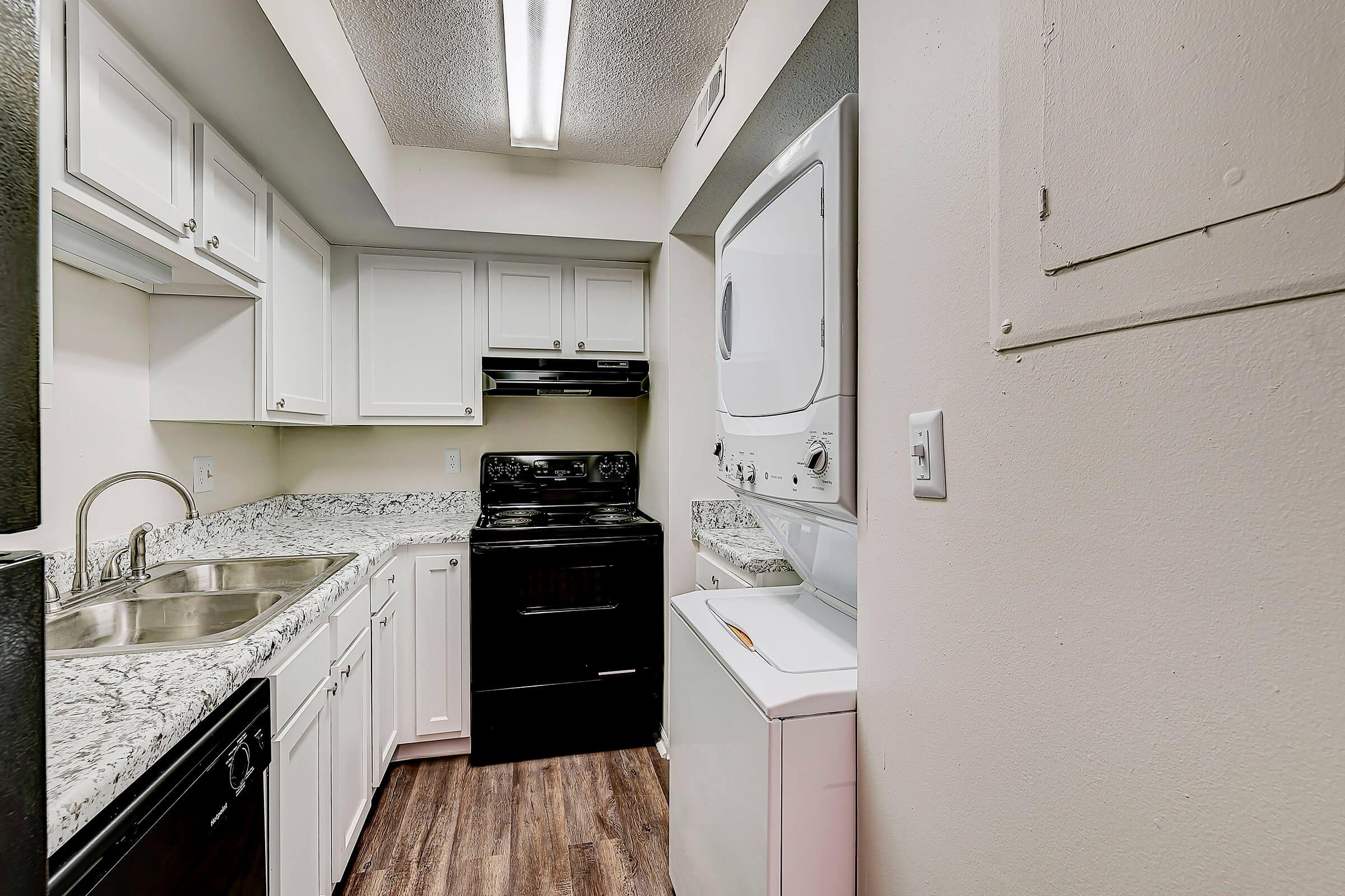 a kitchen with a stove and a refrigerator