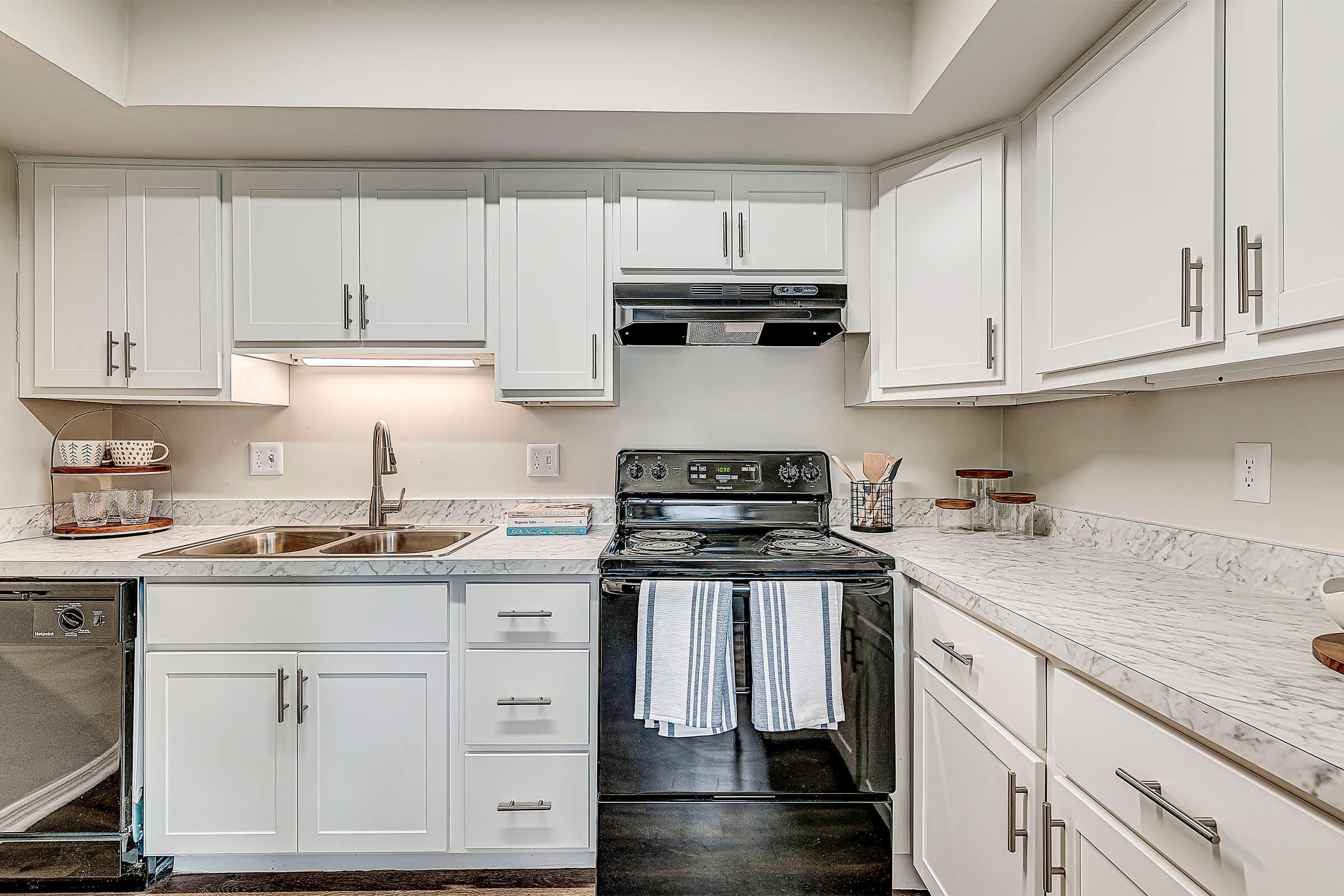 a kitchen with a stove and a sink