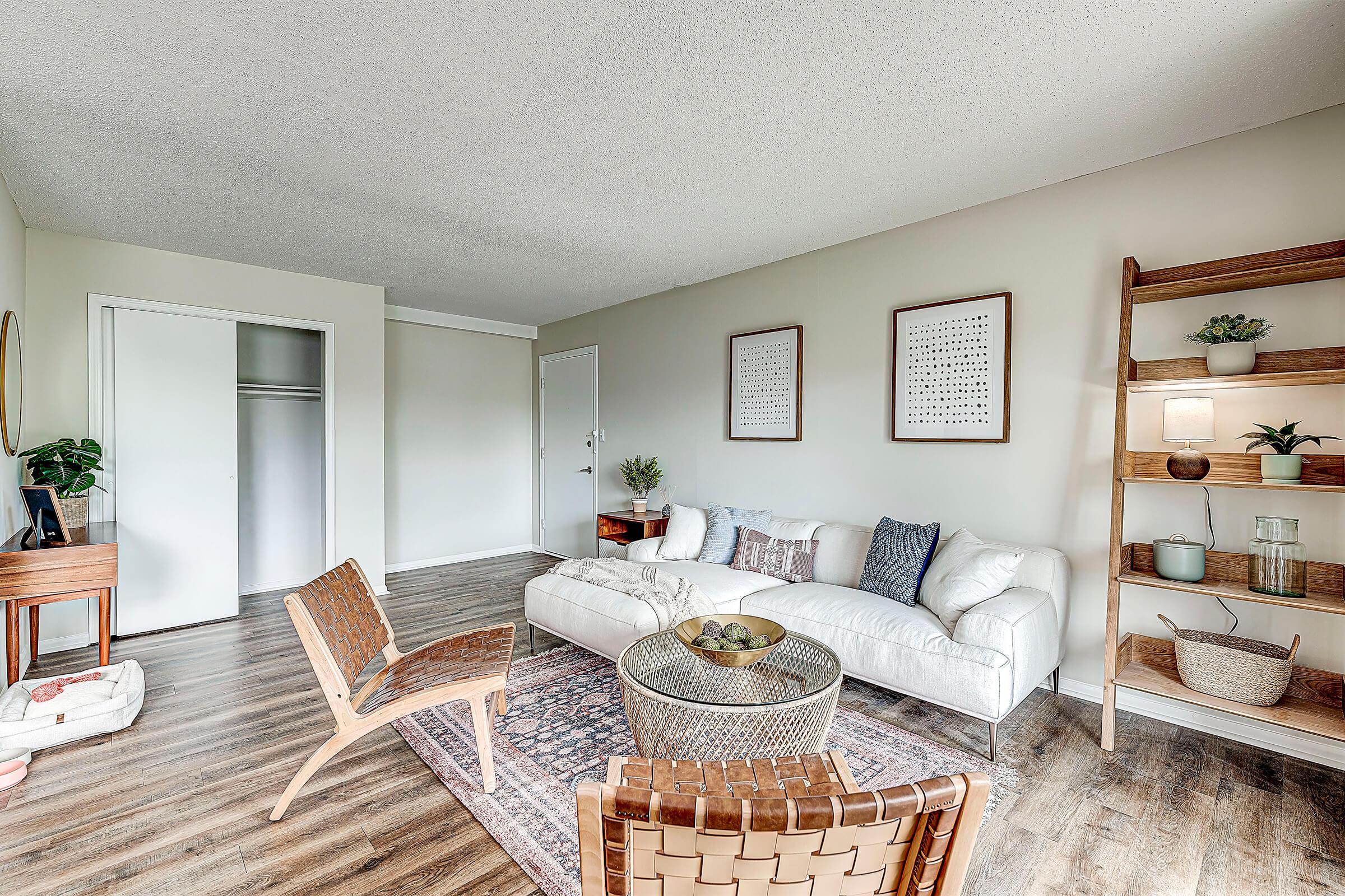 a living room filled with furniture and a fireplace