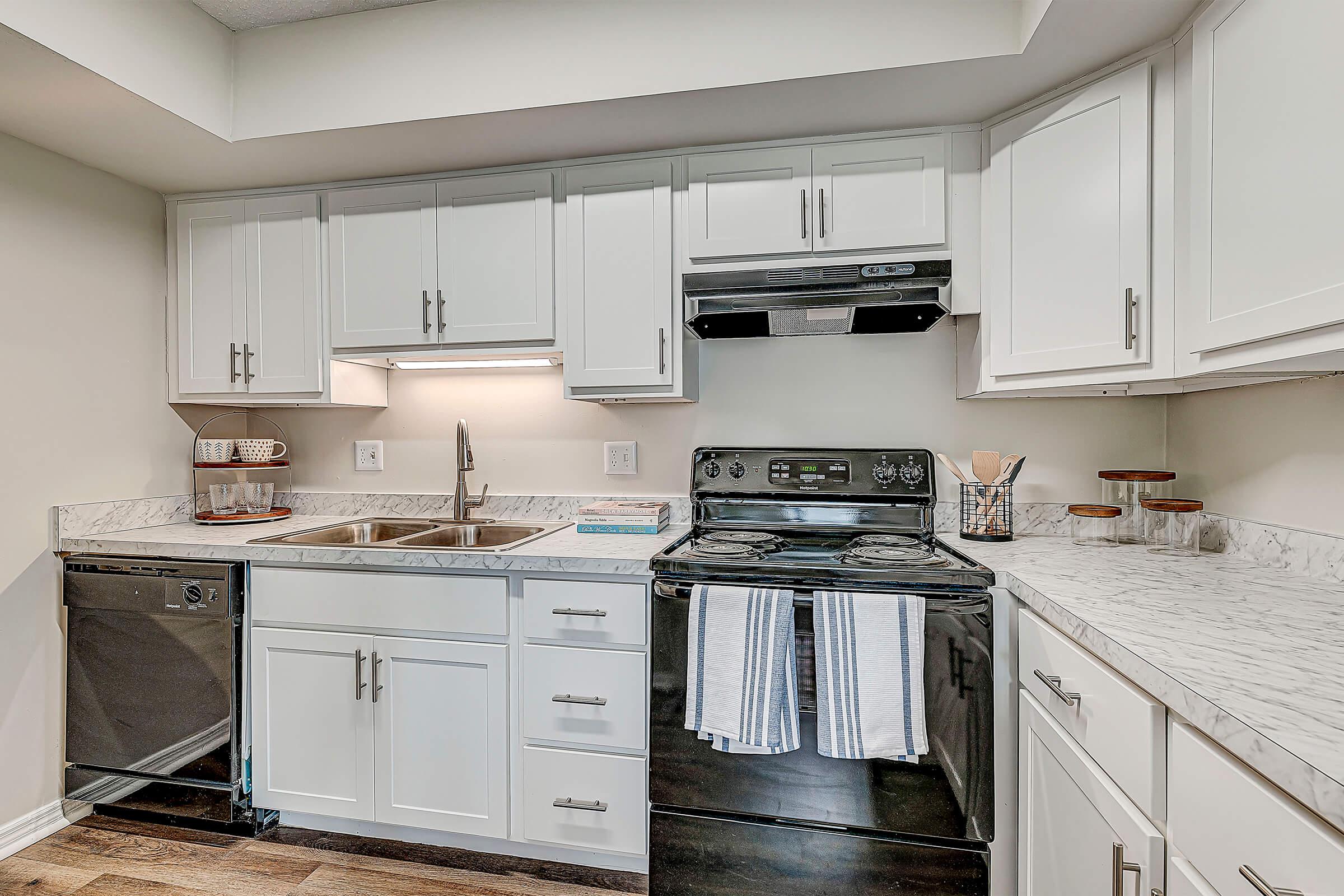 a kitchen with a stove and a sink