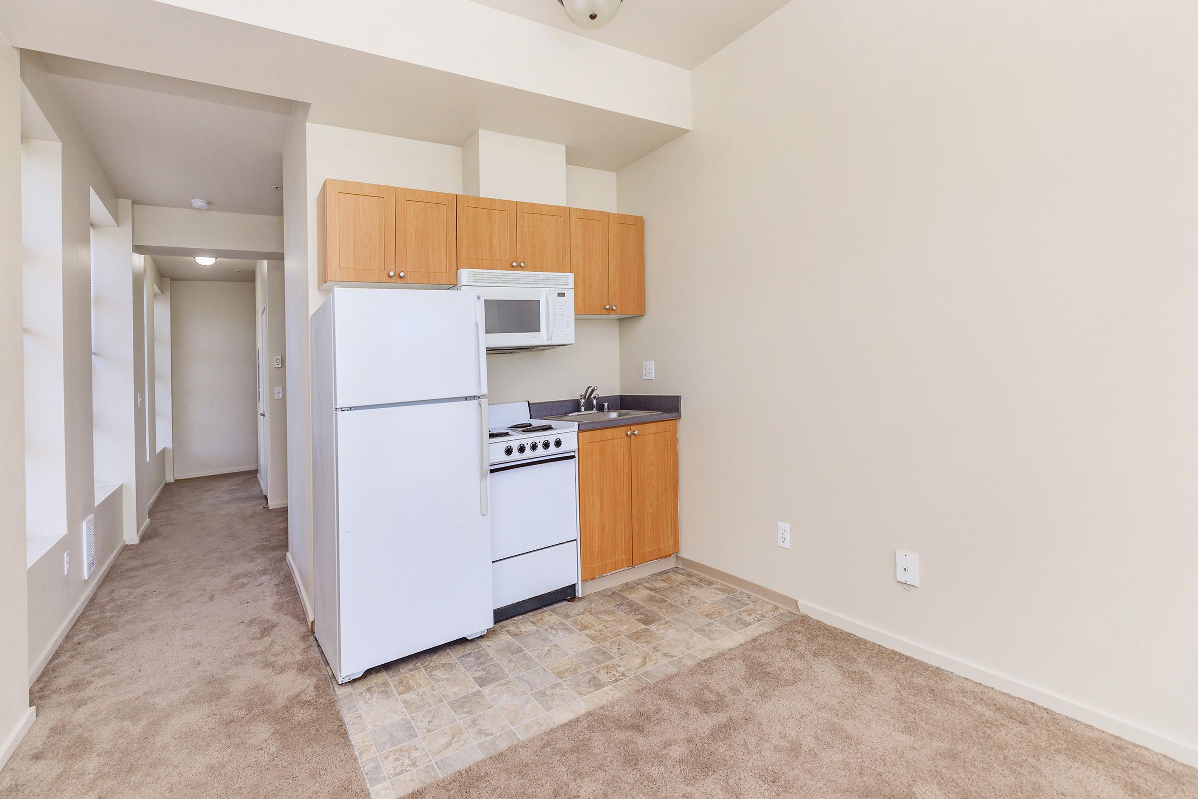 a kitchen with a wooden floor