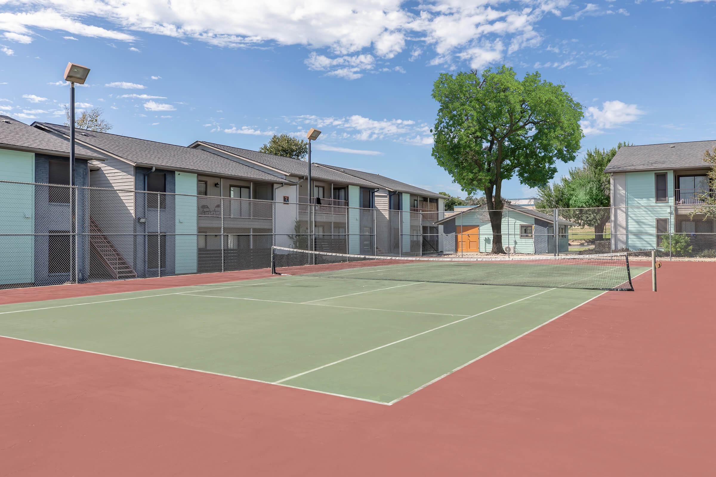 a person on a court with a racket