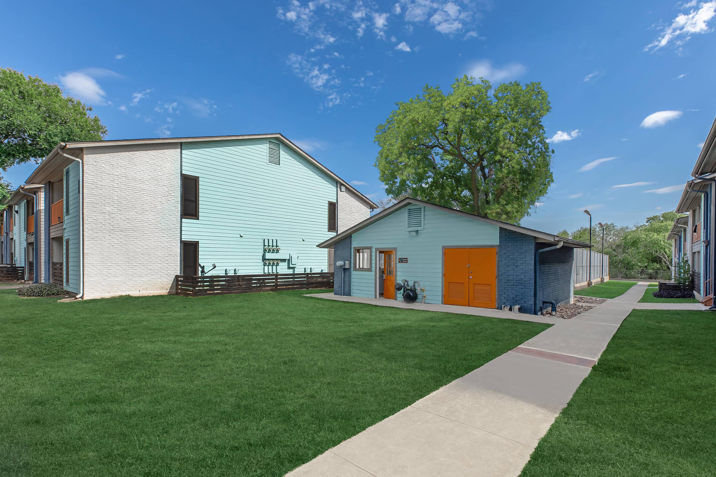 a large lawn in front of a house