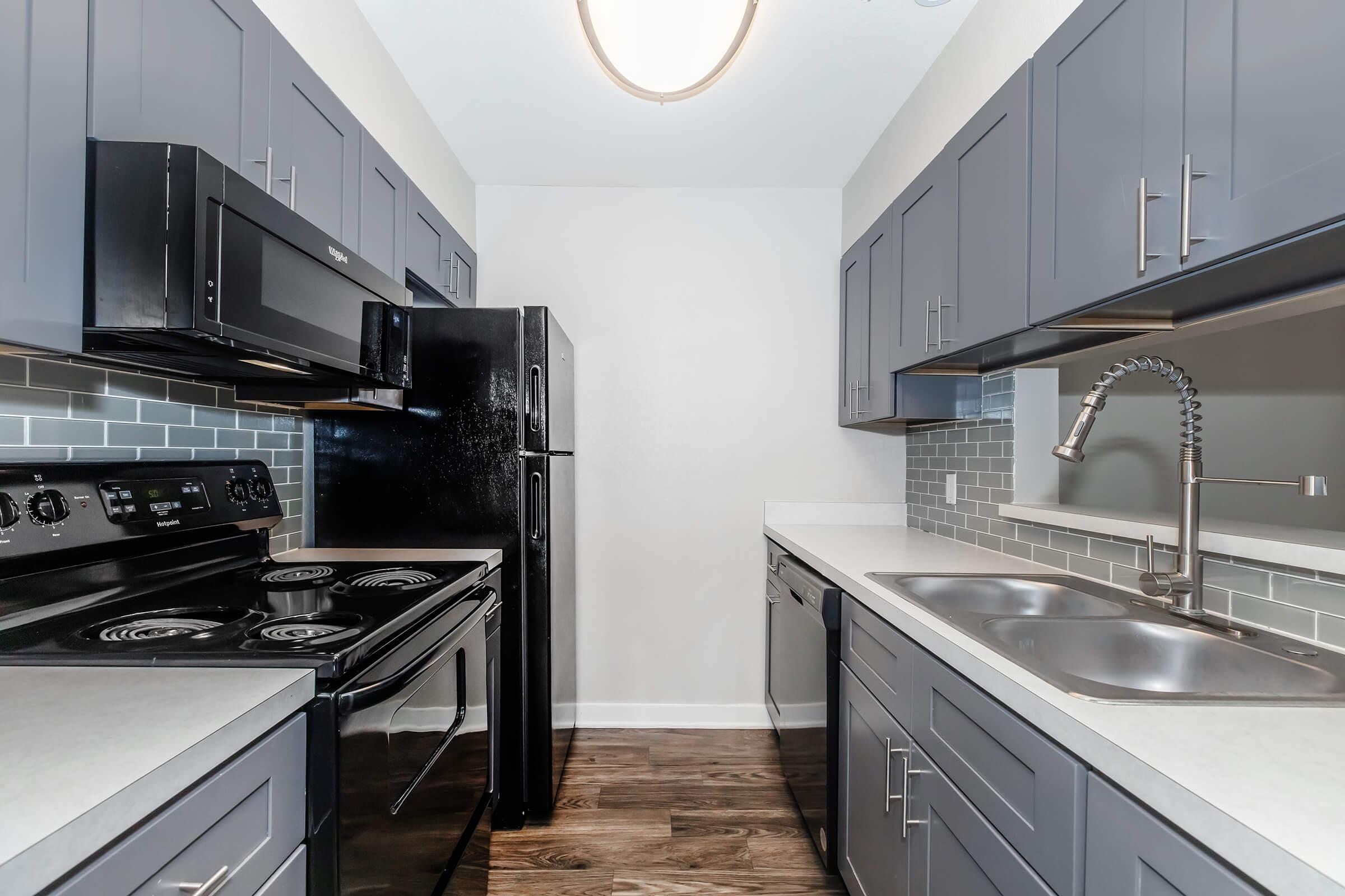 a modern kitchen with stainless steel appliances