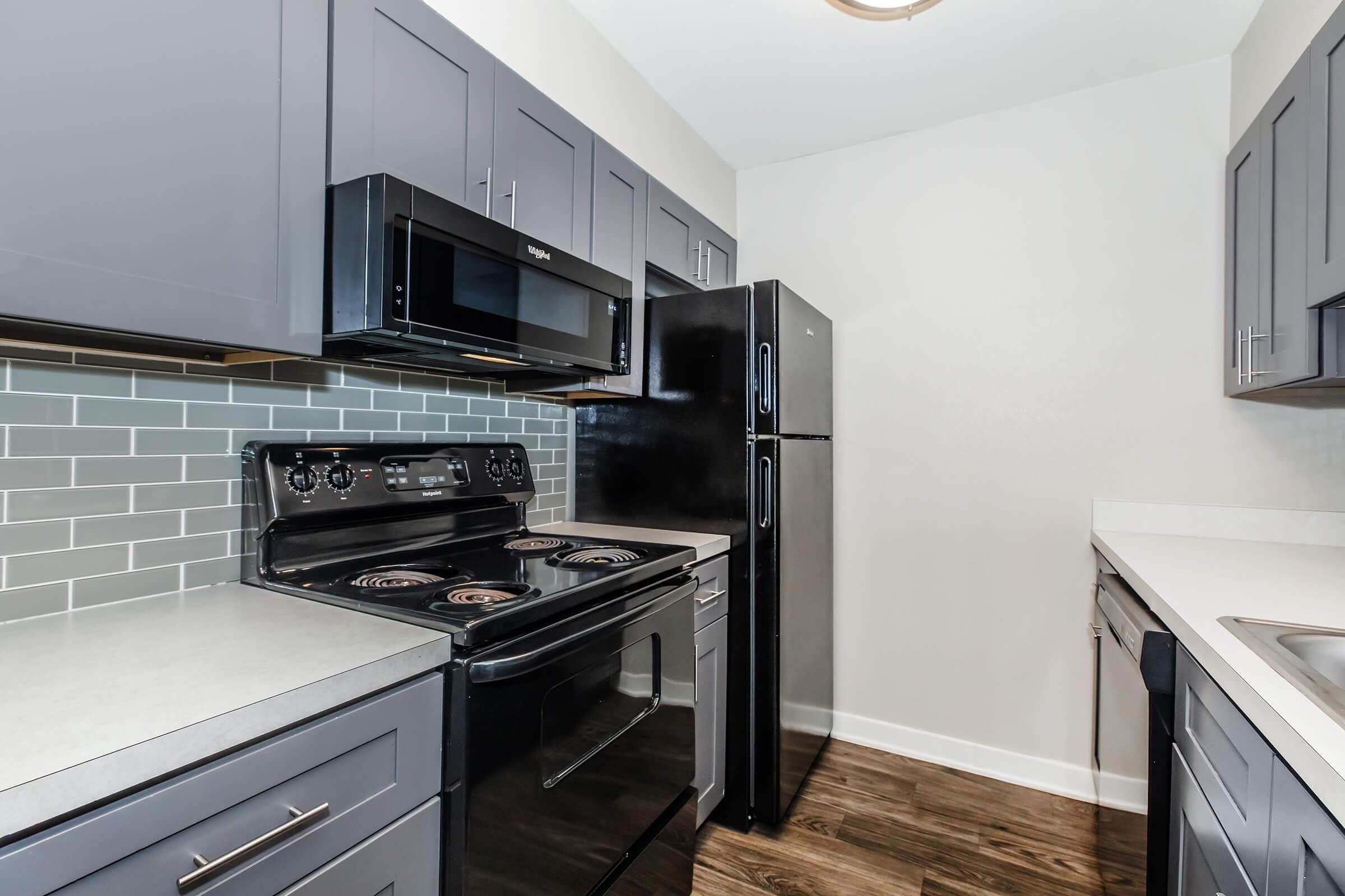 a kitchen with a stove top oven