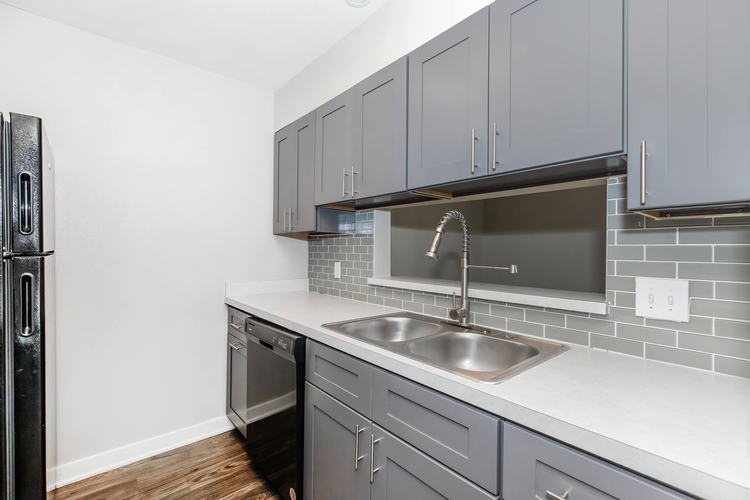 a kitchen with a sink and a window