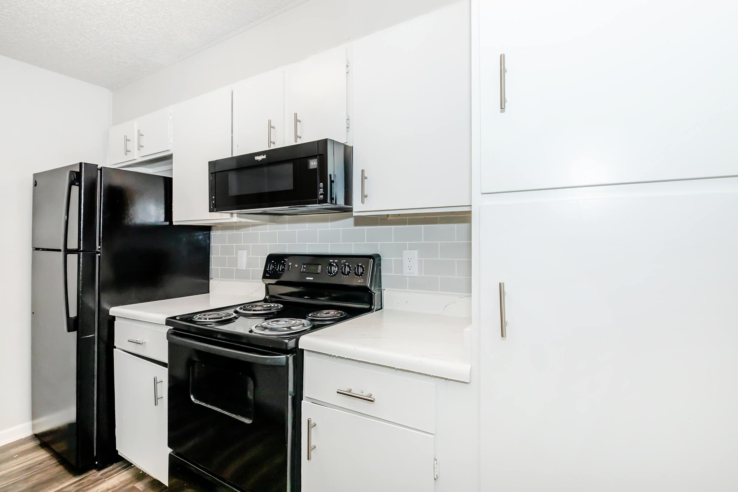 a kitchen with a stove top oven sitting inside of a refrigerator