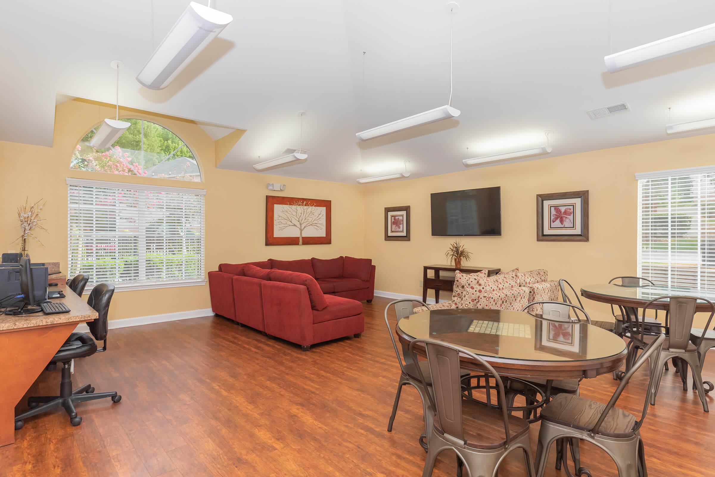 a living room filled with furniture and a fireplace