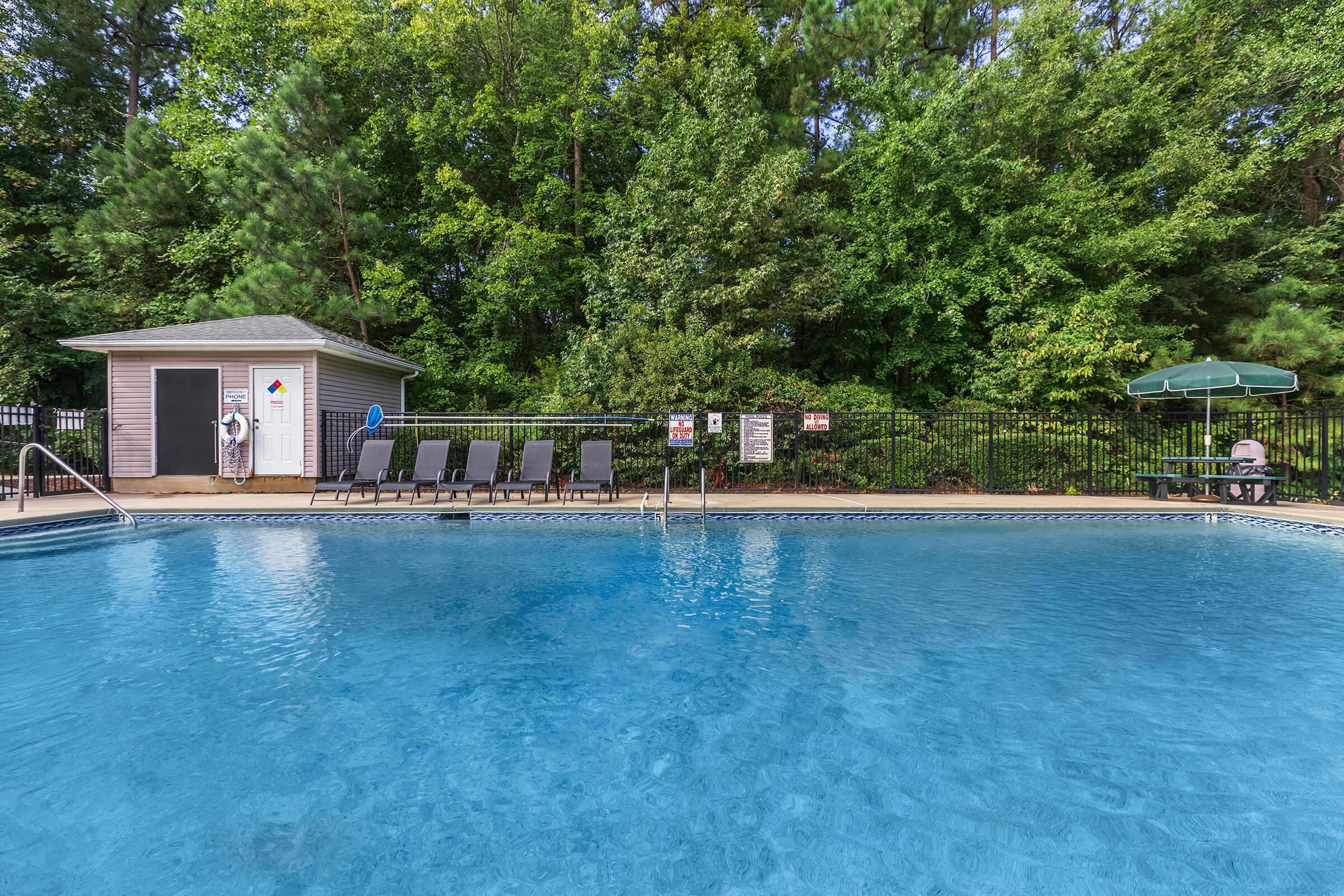 a pool next to a body of water