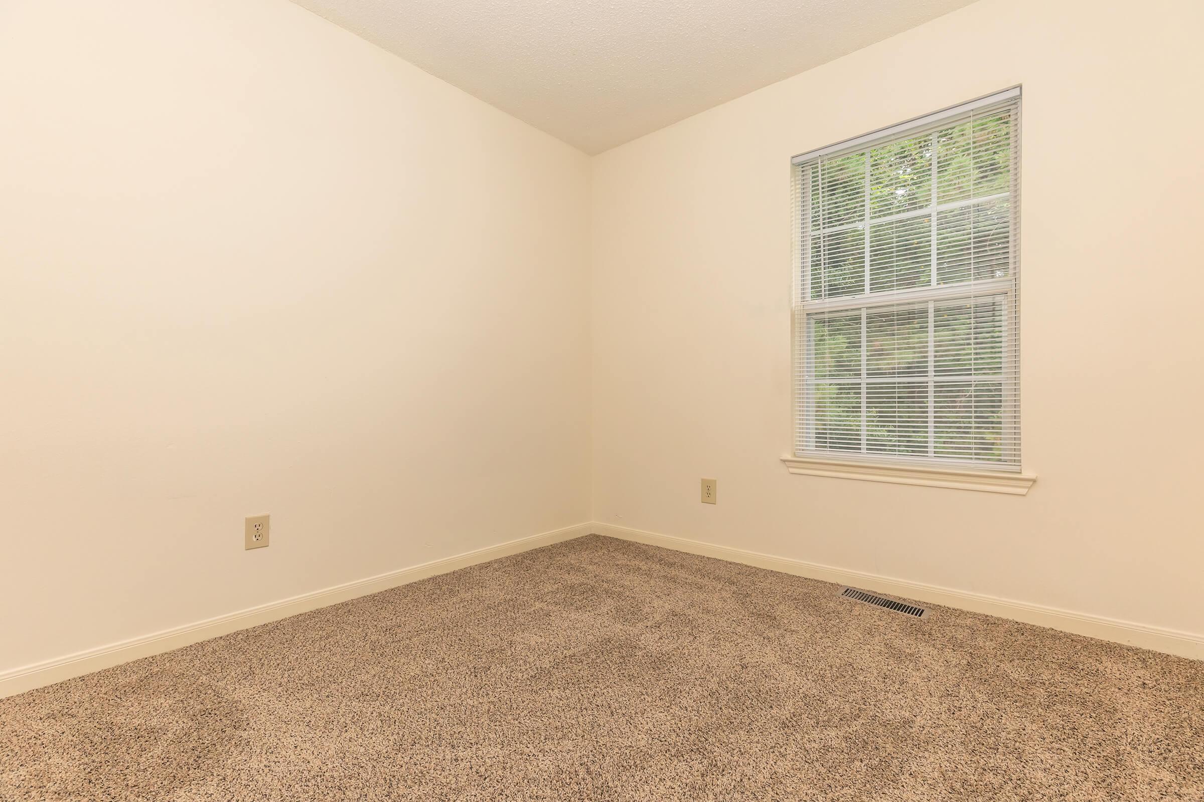 a bedroom with a large window