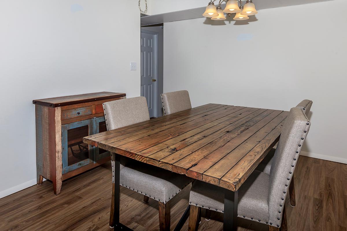 a wooden bench sitting in the middle of a room