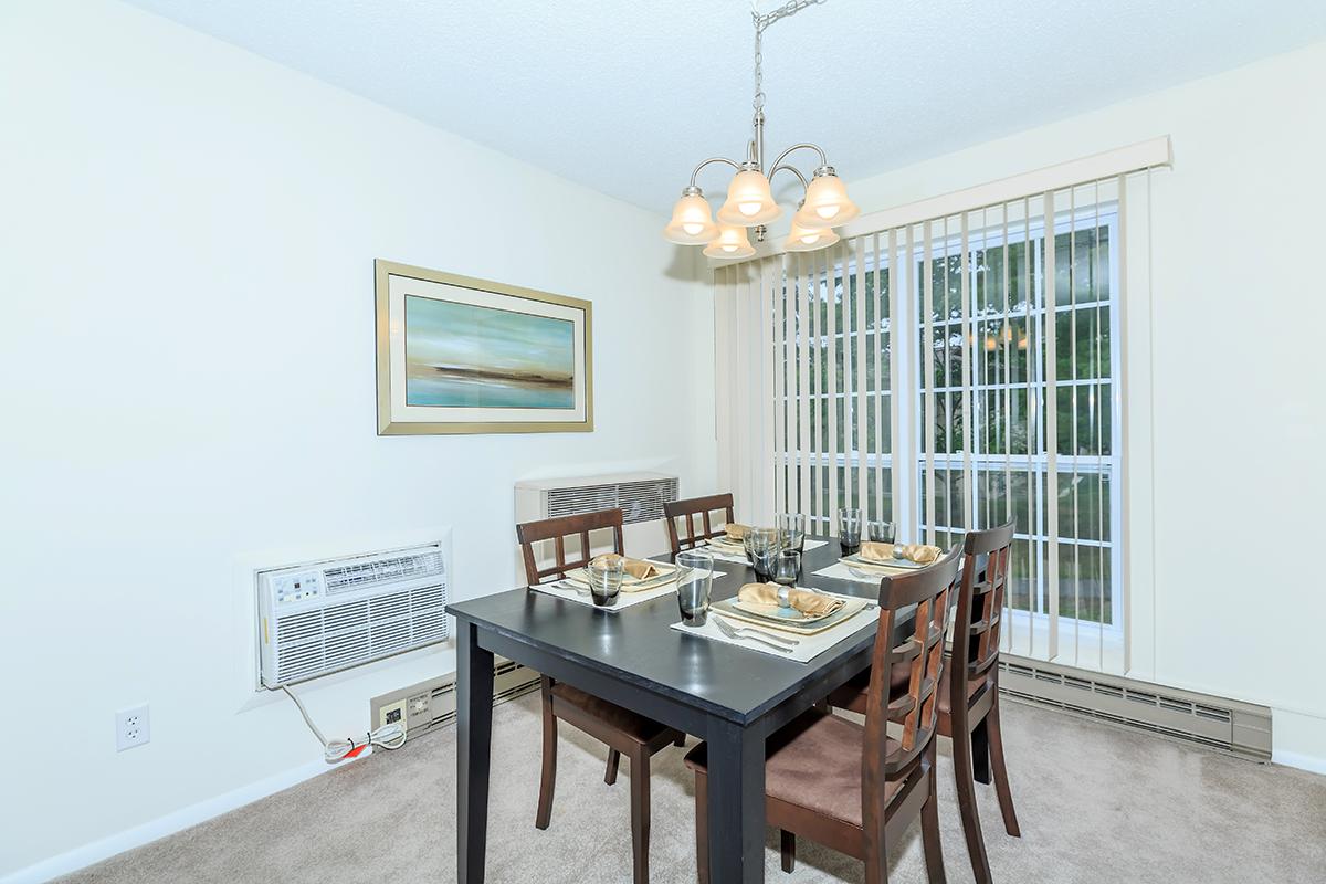 a living room filled with furniture and a large window