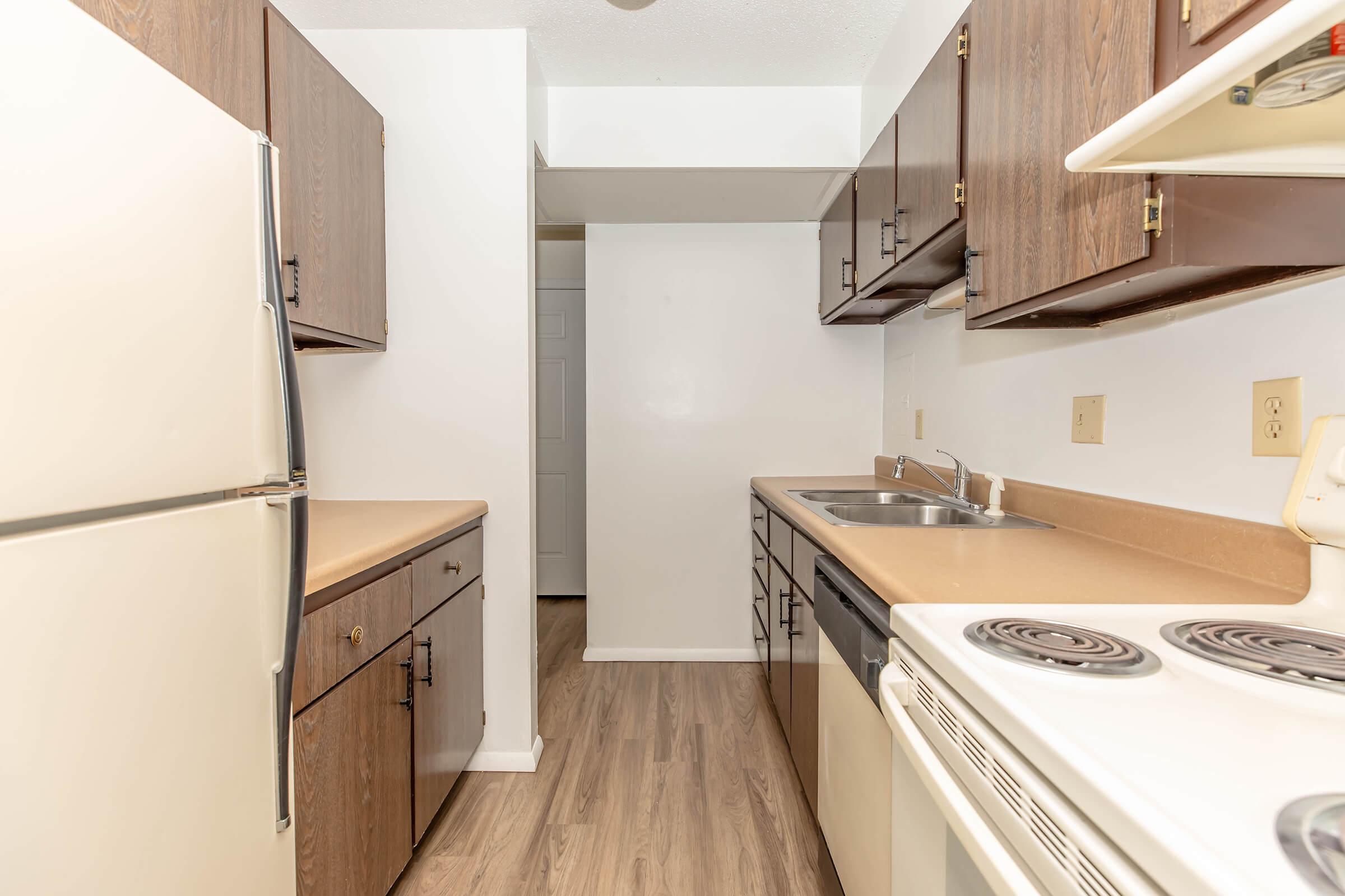 a kitchen with a stove top oven sitting inside of a refrigerator