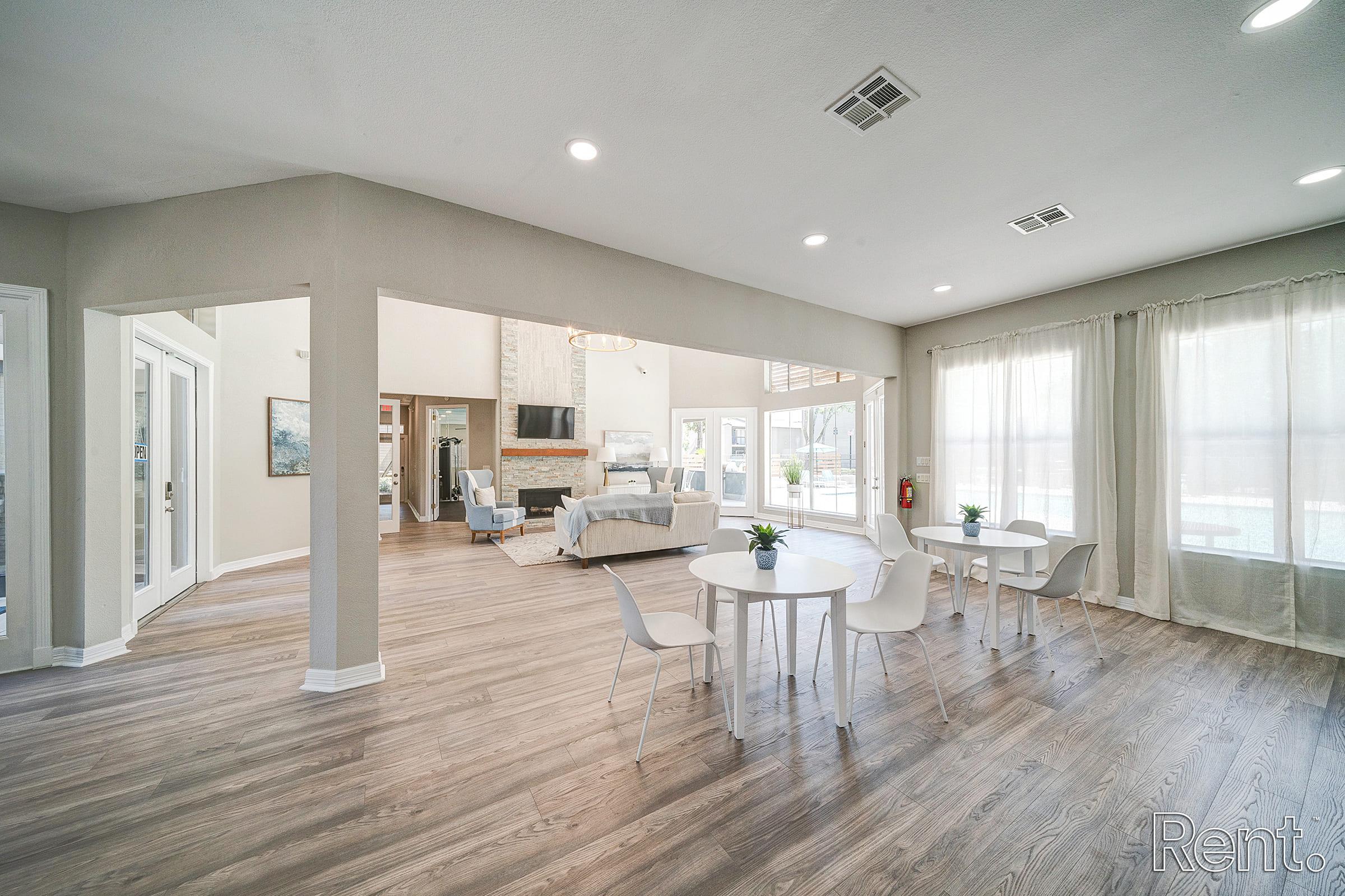 a room filled with furniture and a large window