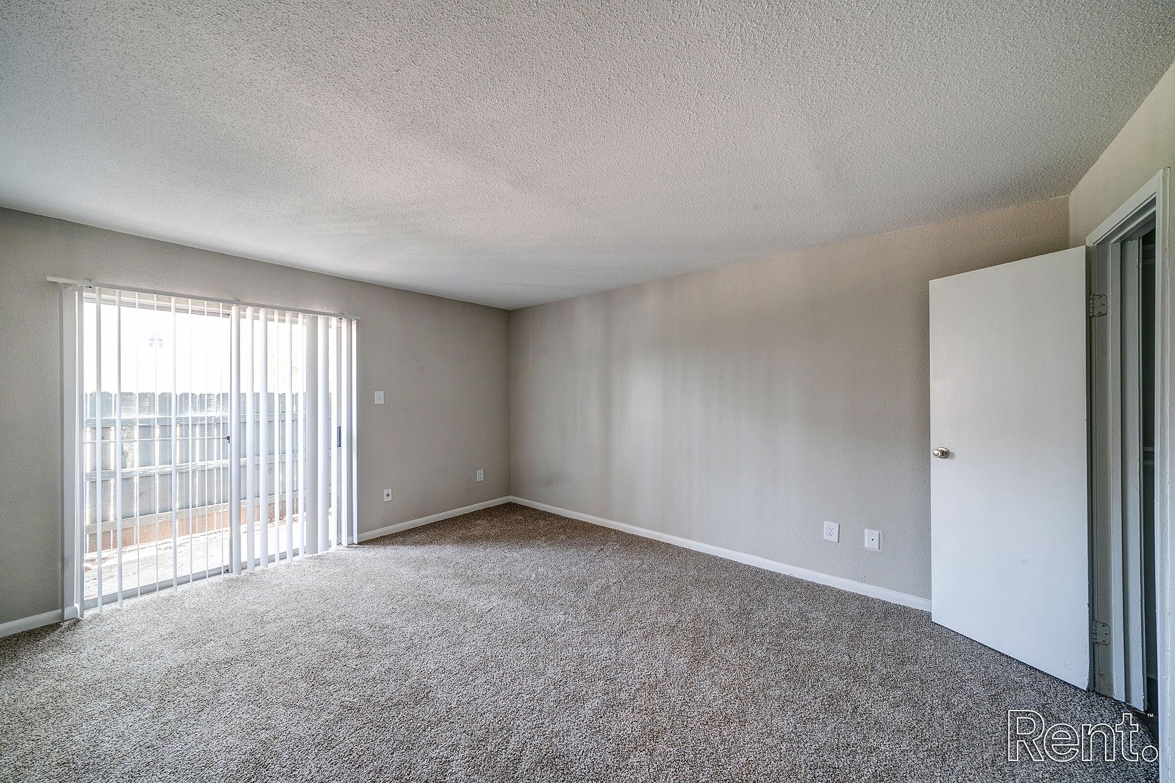 a bedroom with a large window