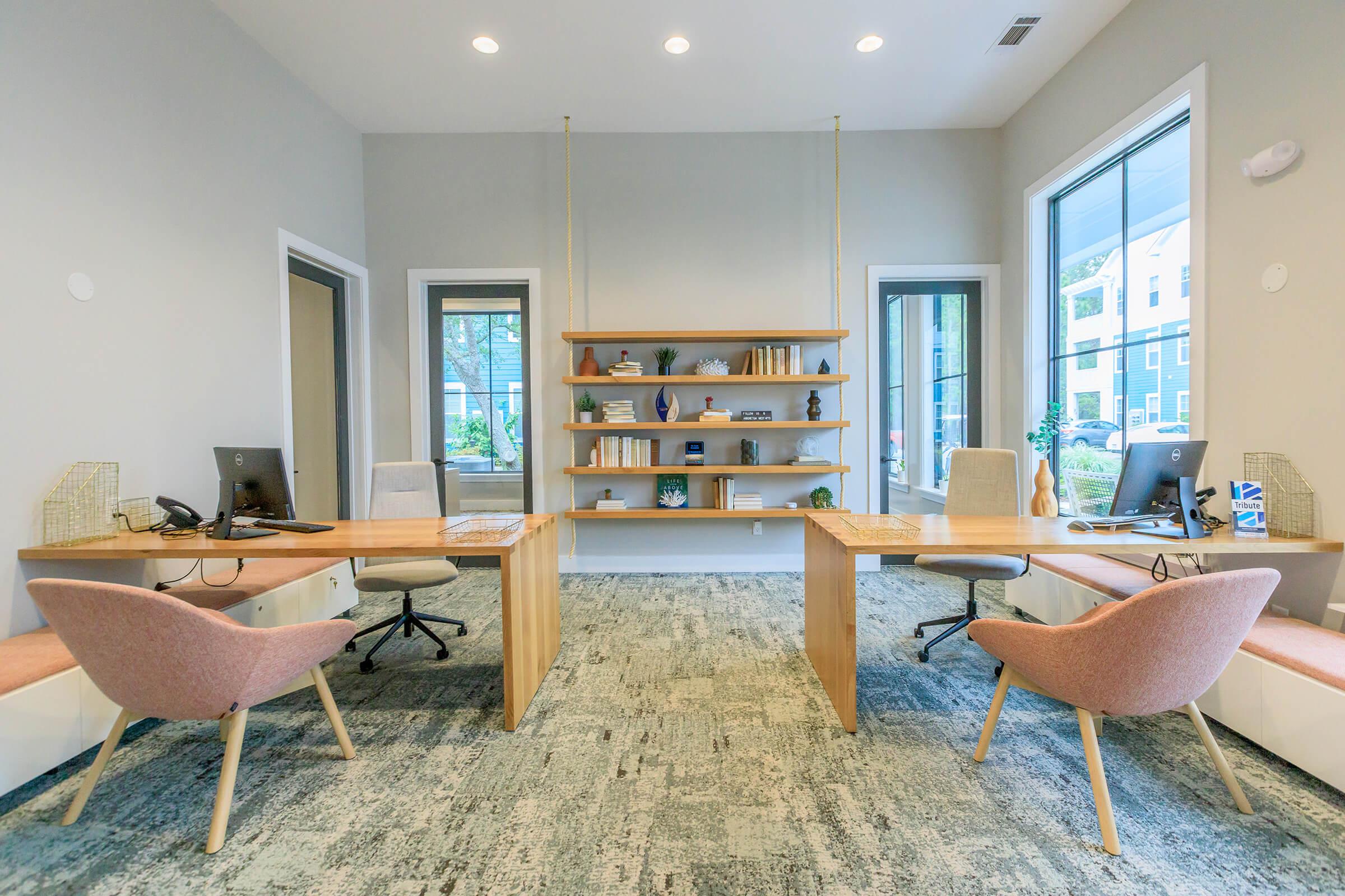 a room filled with furniture and a large window