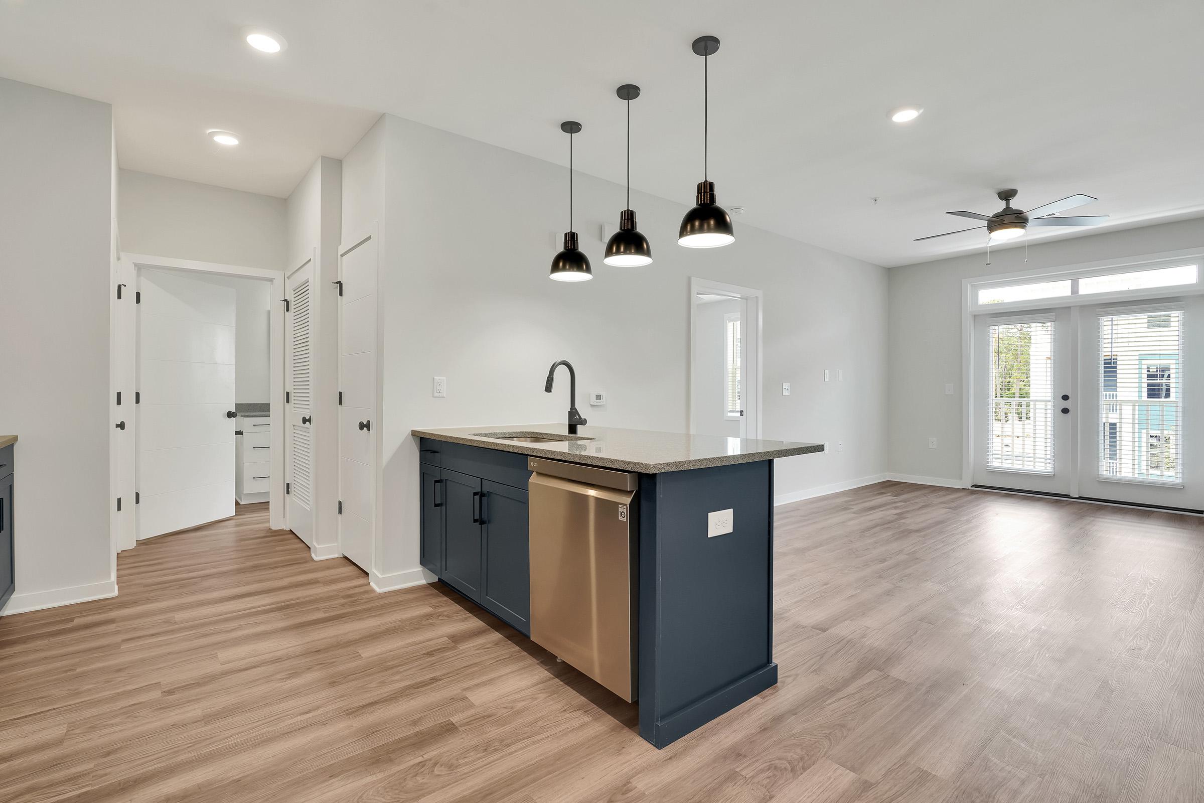 a kitchen with a wood floor