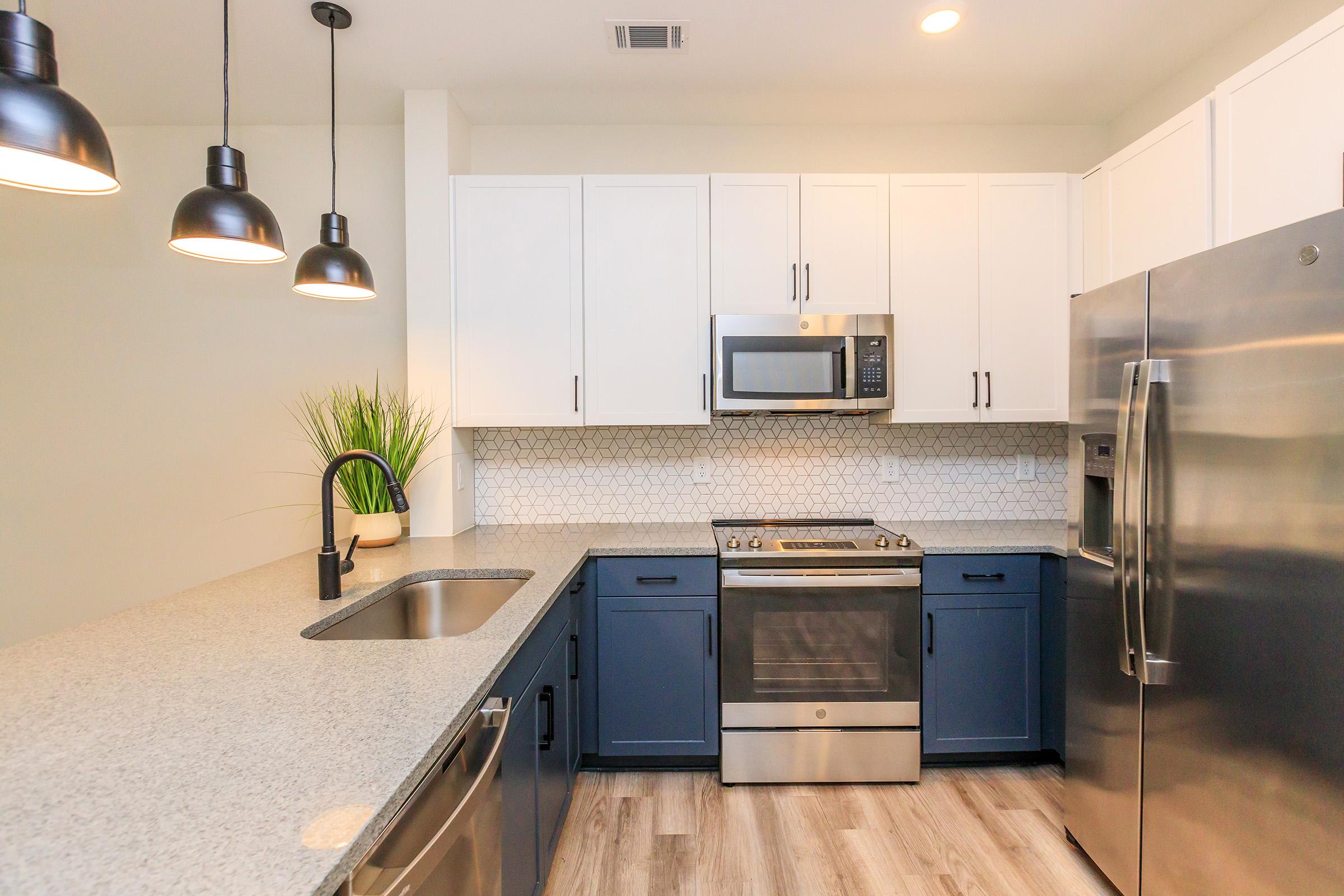 a modern kitchen with stainless steel appliances