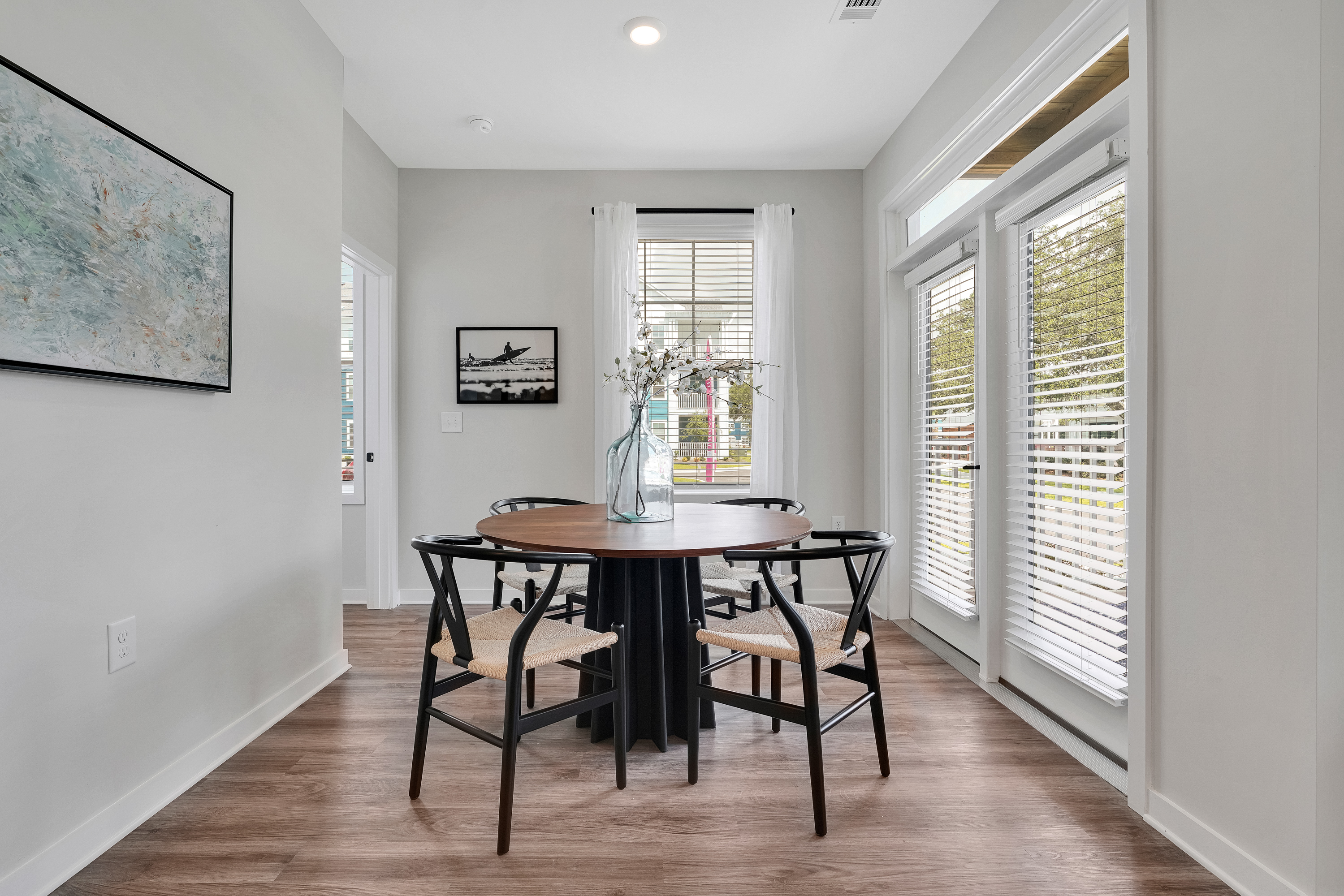 a room filled with furniture and a large window