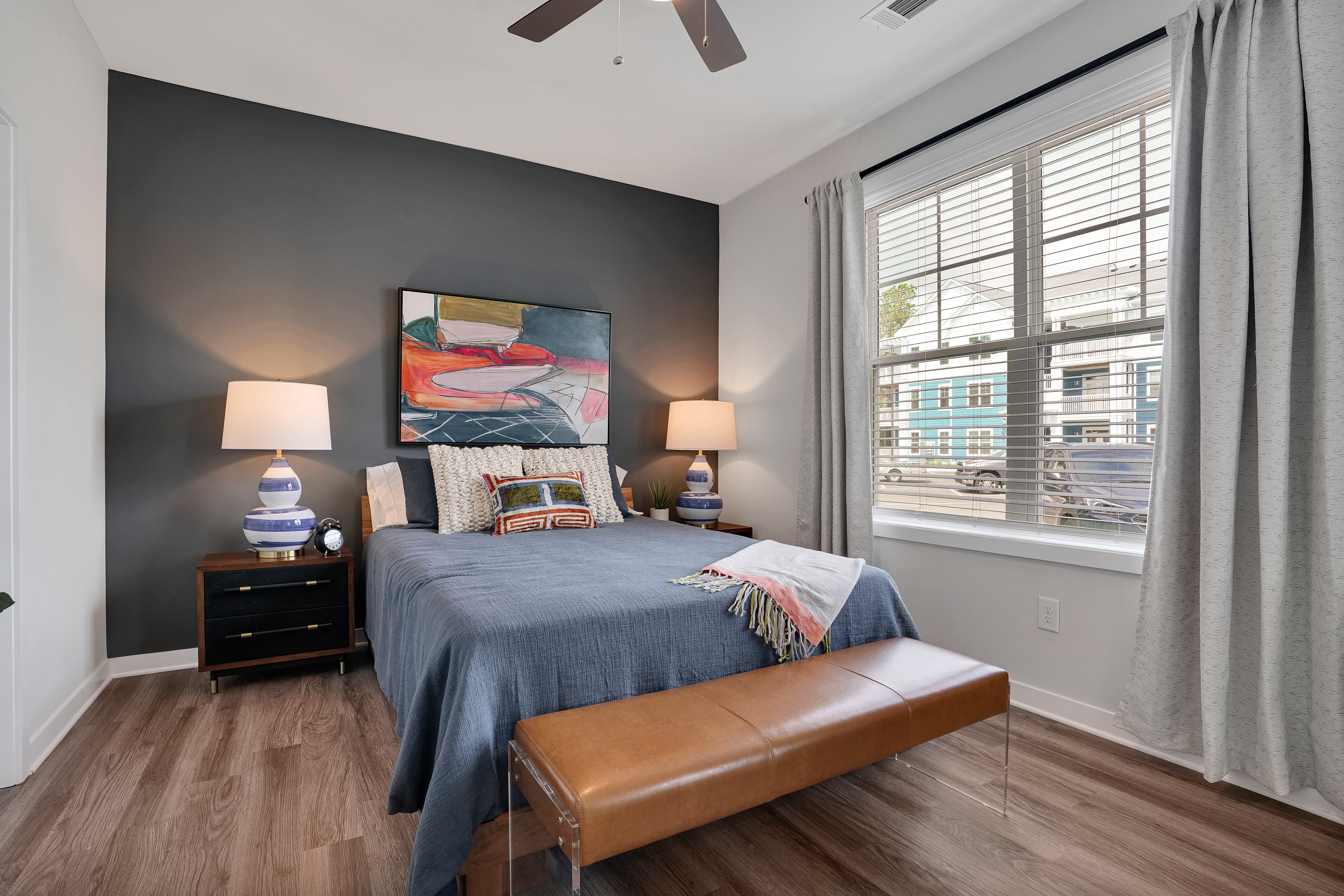 a living room with a bed and a window