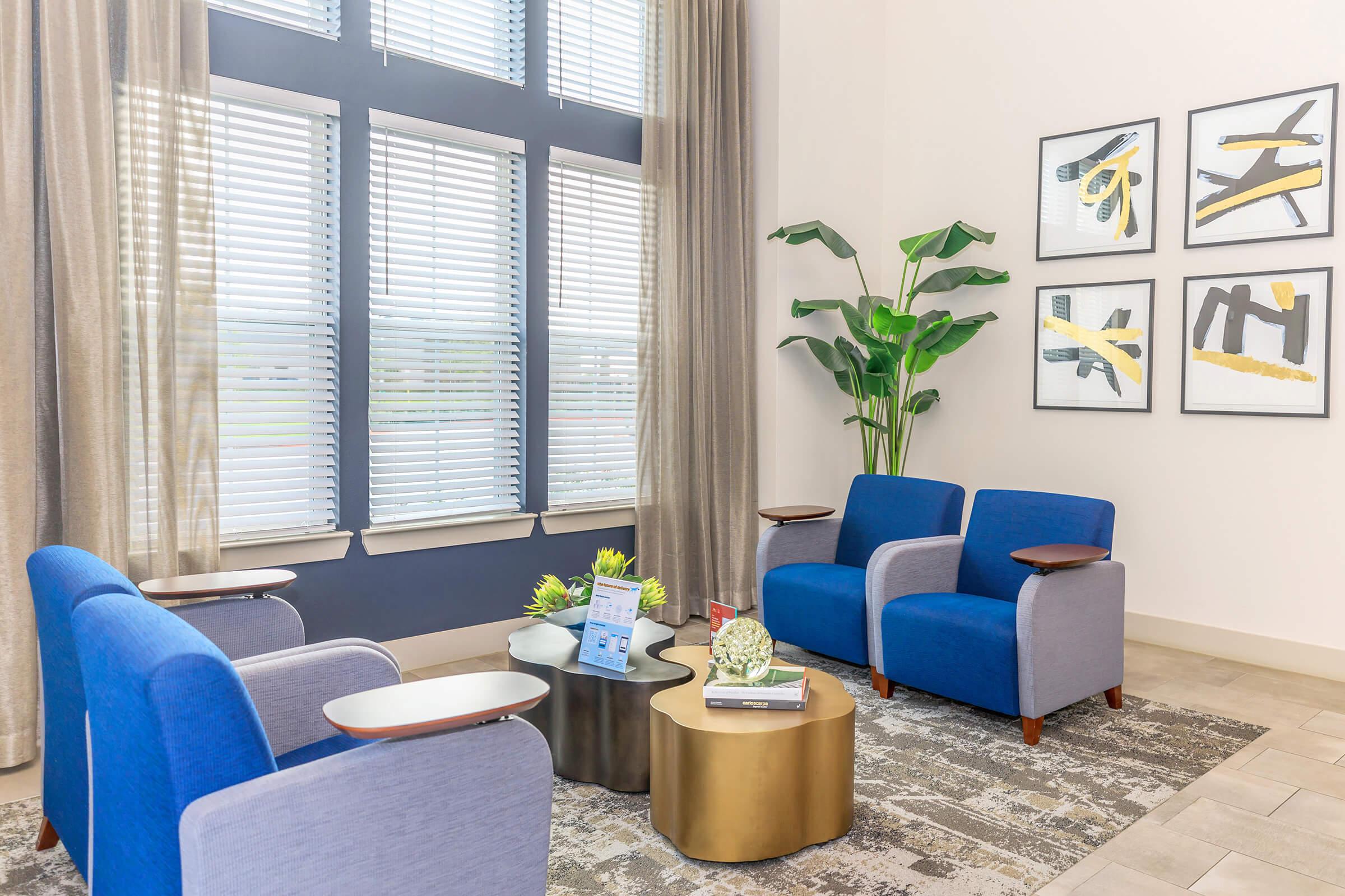 a living room filled with furniture and a large window