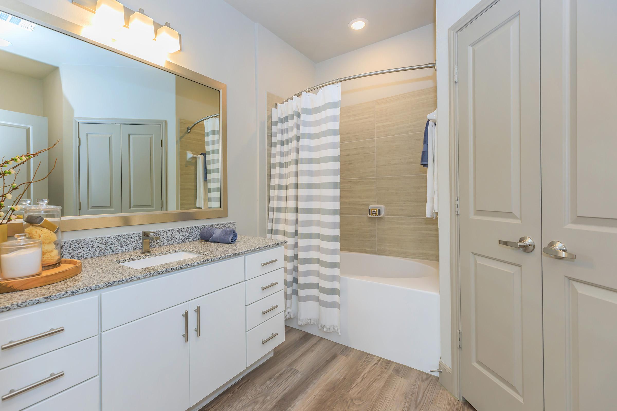 a kitchen with a sink and a mirror