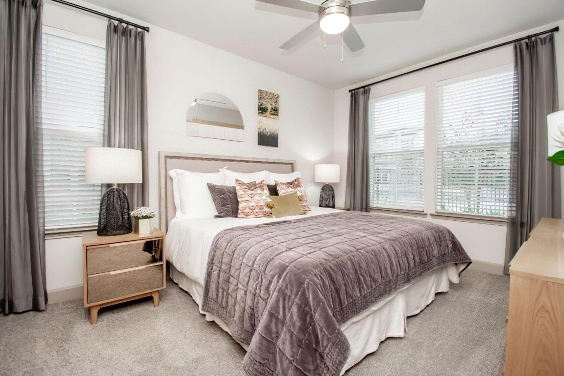 a bedroom with a large bed in a hotel room