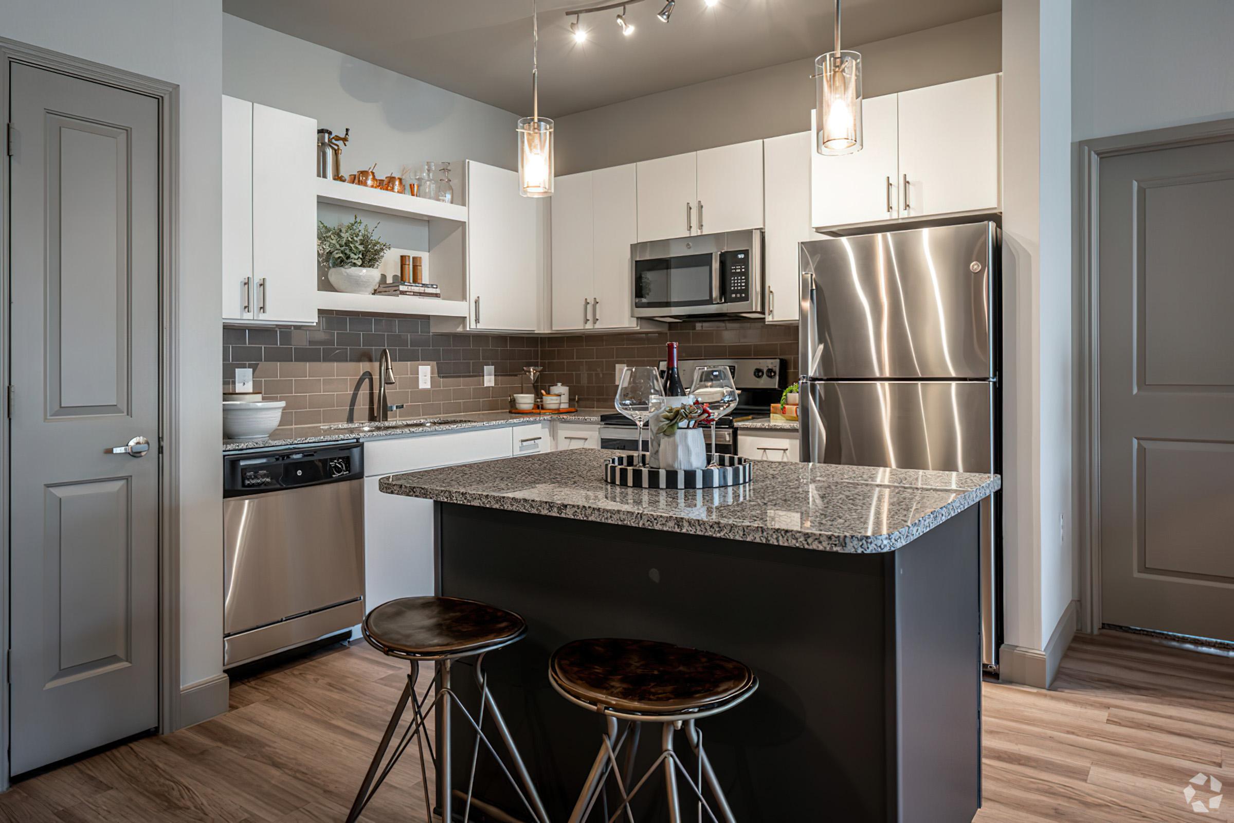 a modern kitchen with stainless steel appliances