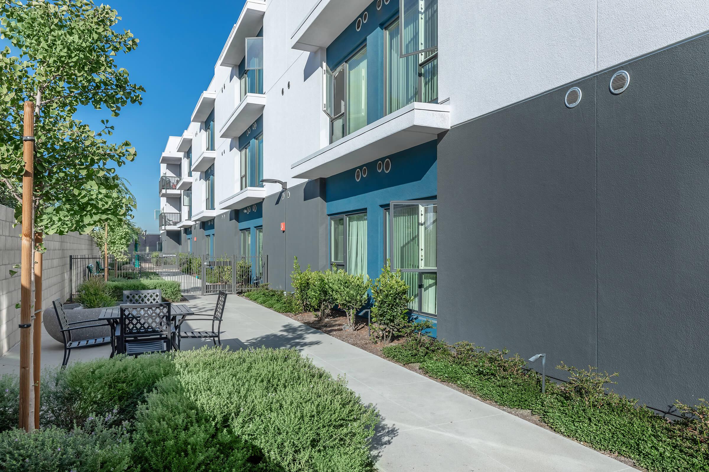 a house with a lawn in front of a building