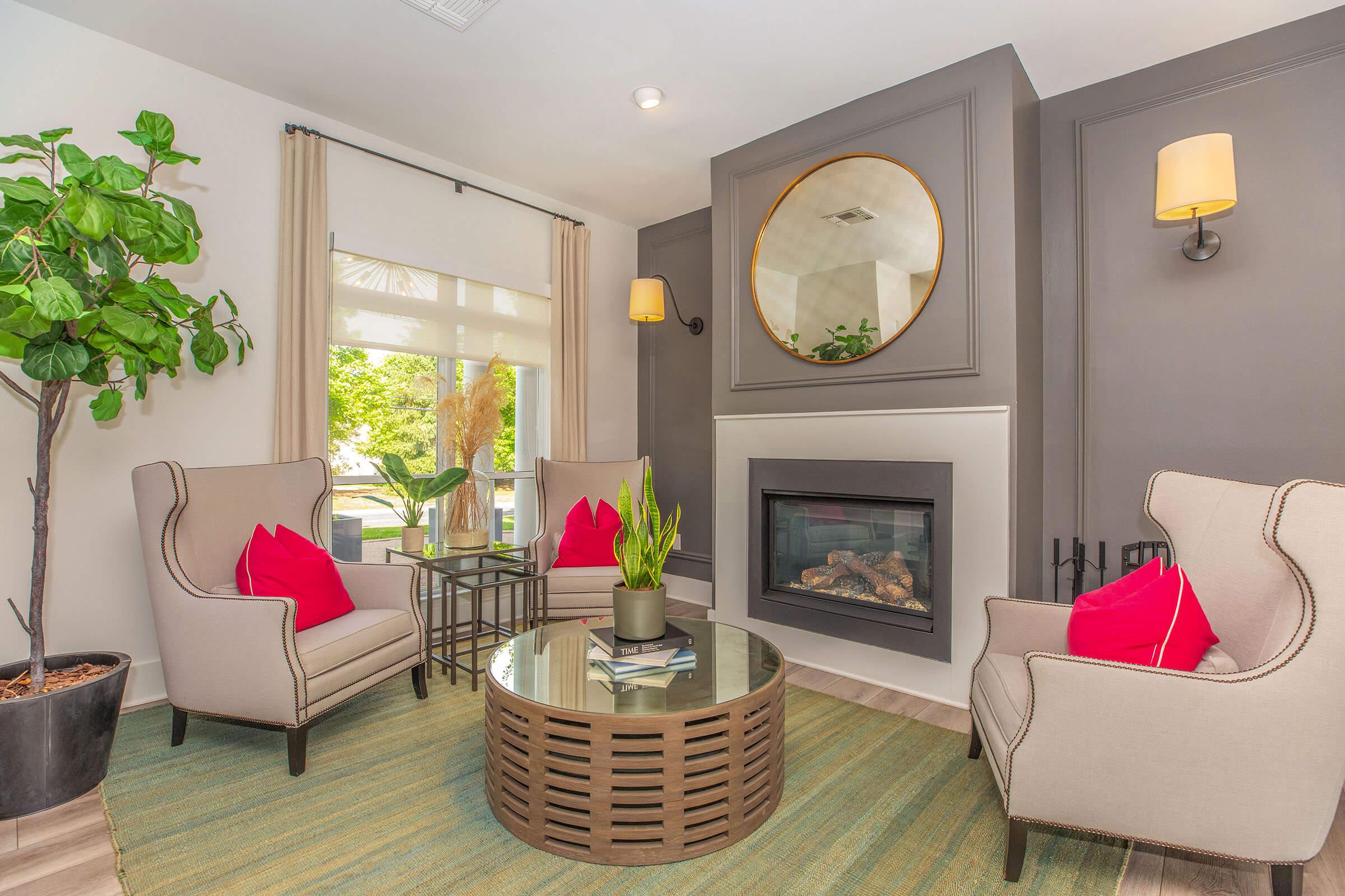 a living room filled with furniture and a flat screen tv