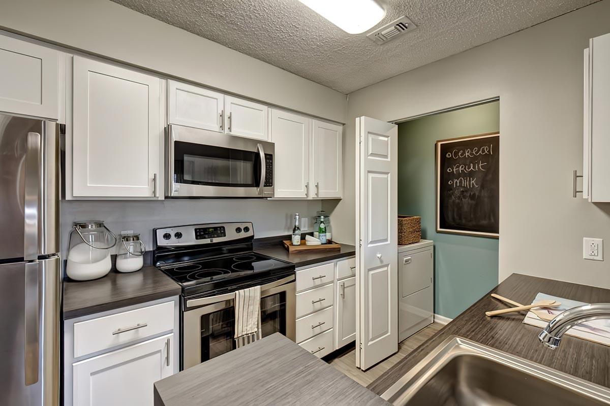 a modern kitchen with stainless steel appliances