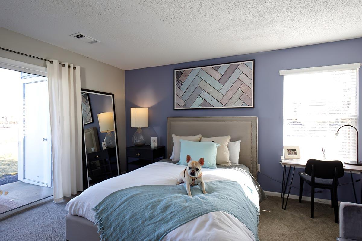 a bedroom with a large bed sitting in a room