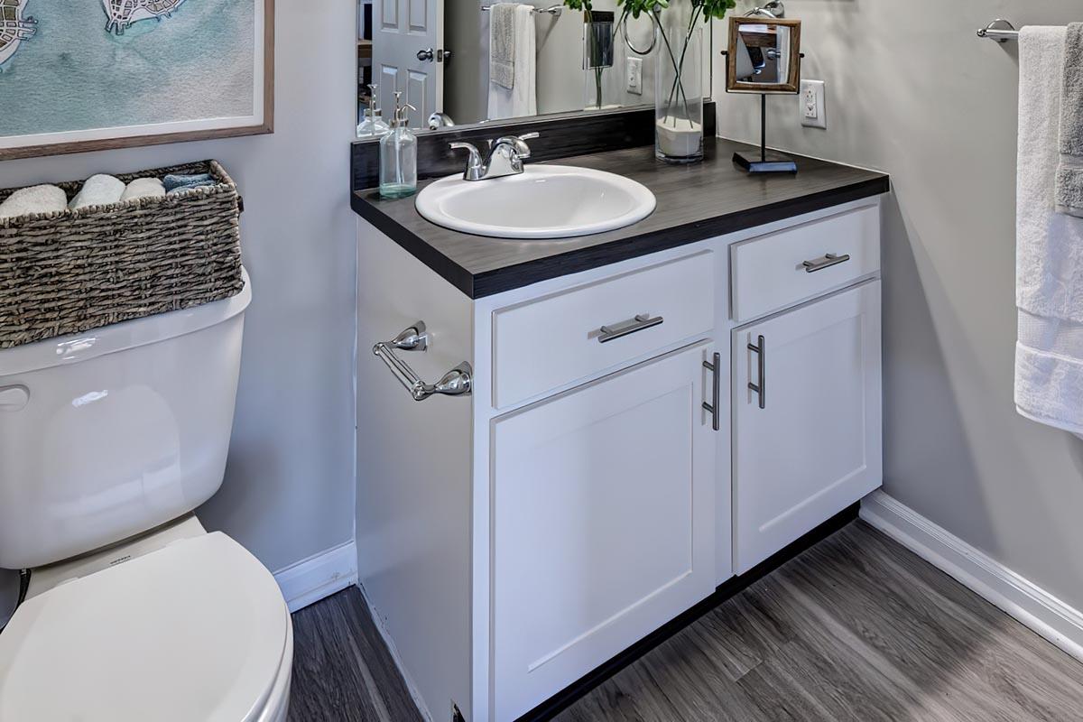 a kitchen with a sink and a mirror