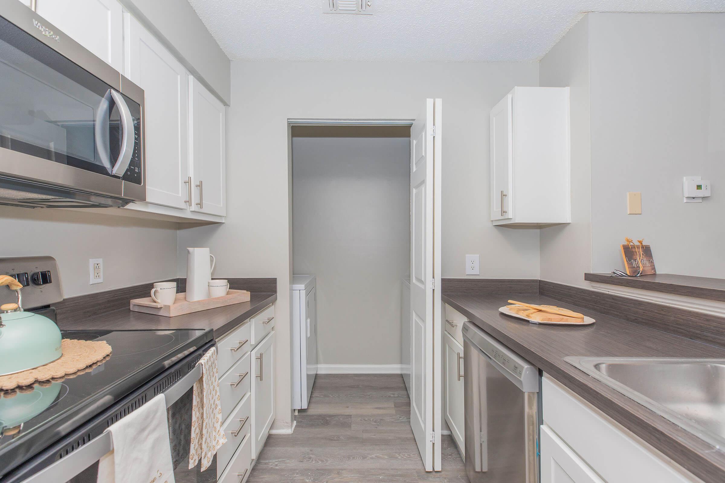 a kitchen with a sink and a microwave