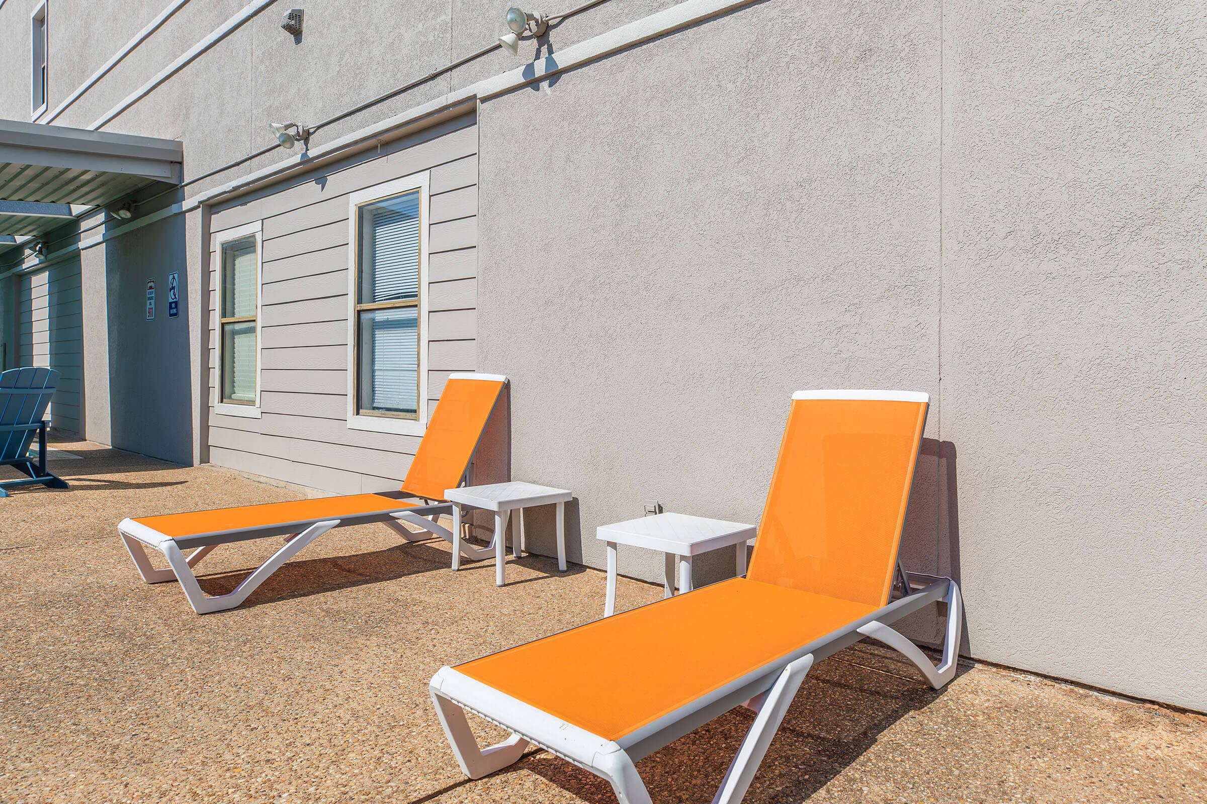 a chair sitting in front of a building