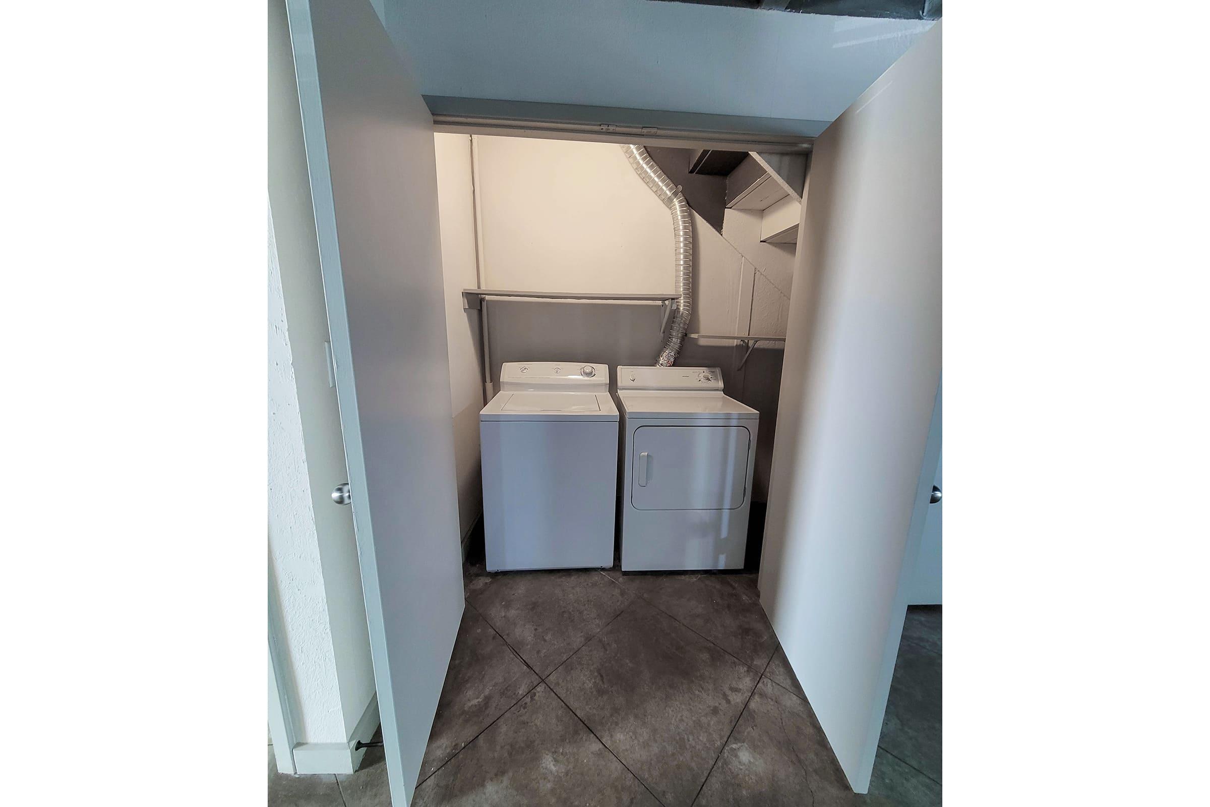 a refrigerator in a small room