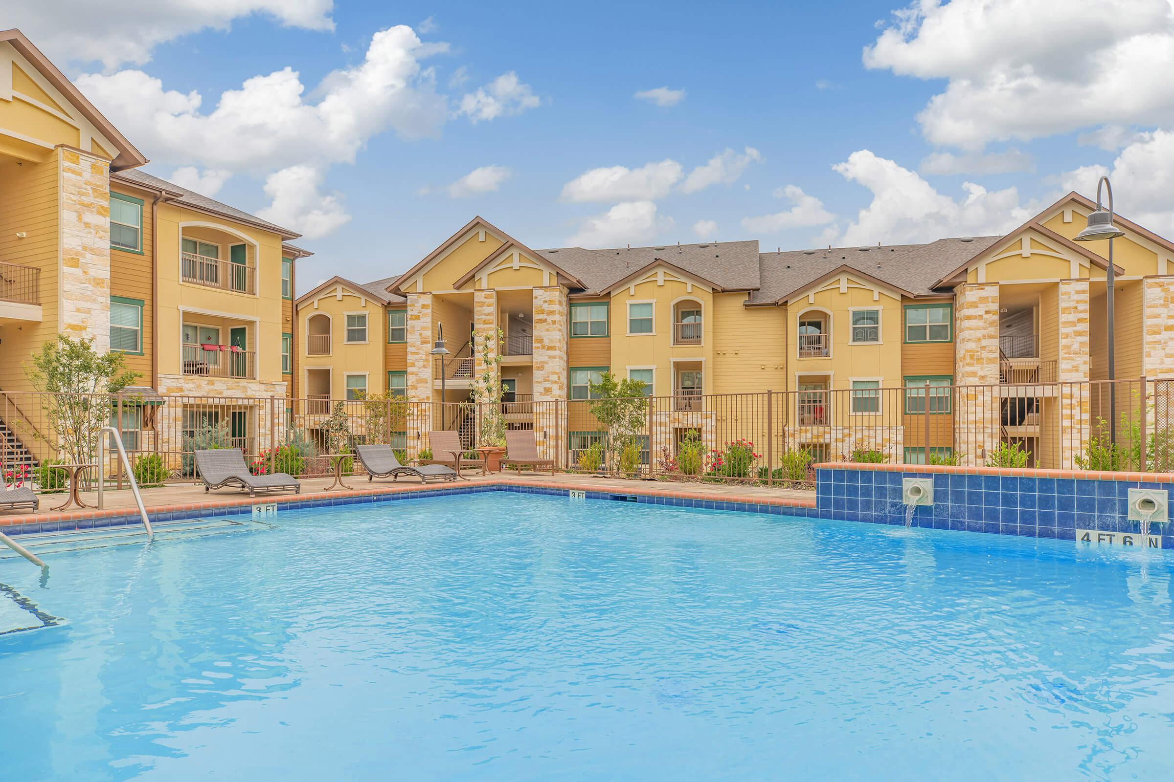 a house with a large pool of water