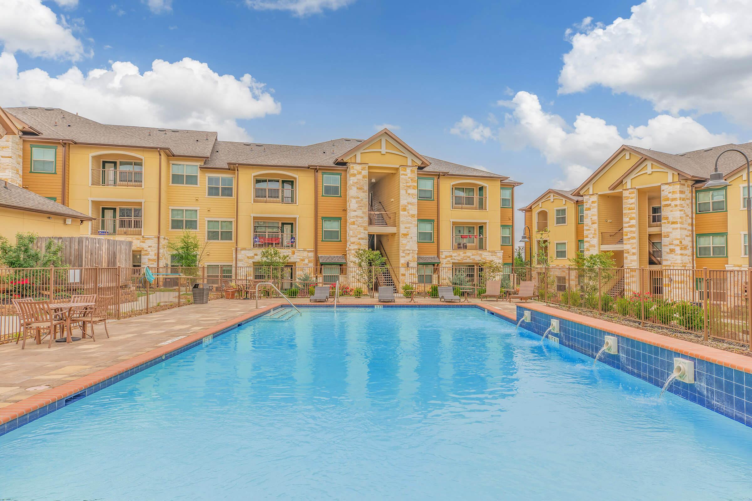 A RELAXING RESORT STYLE POOL WITH SUN DECK