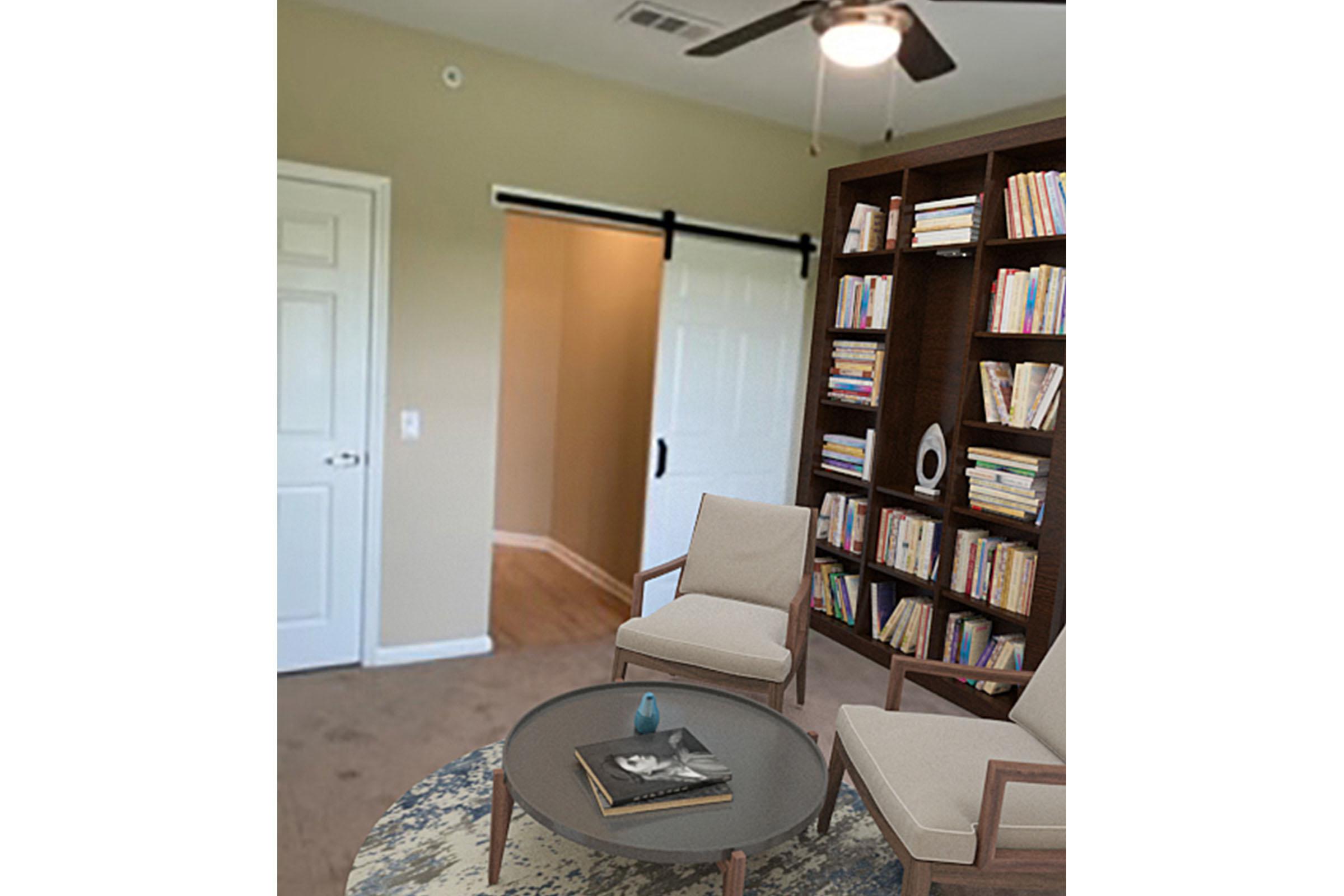 a living room with a book shelf