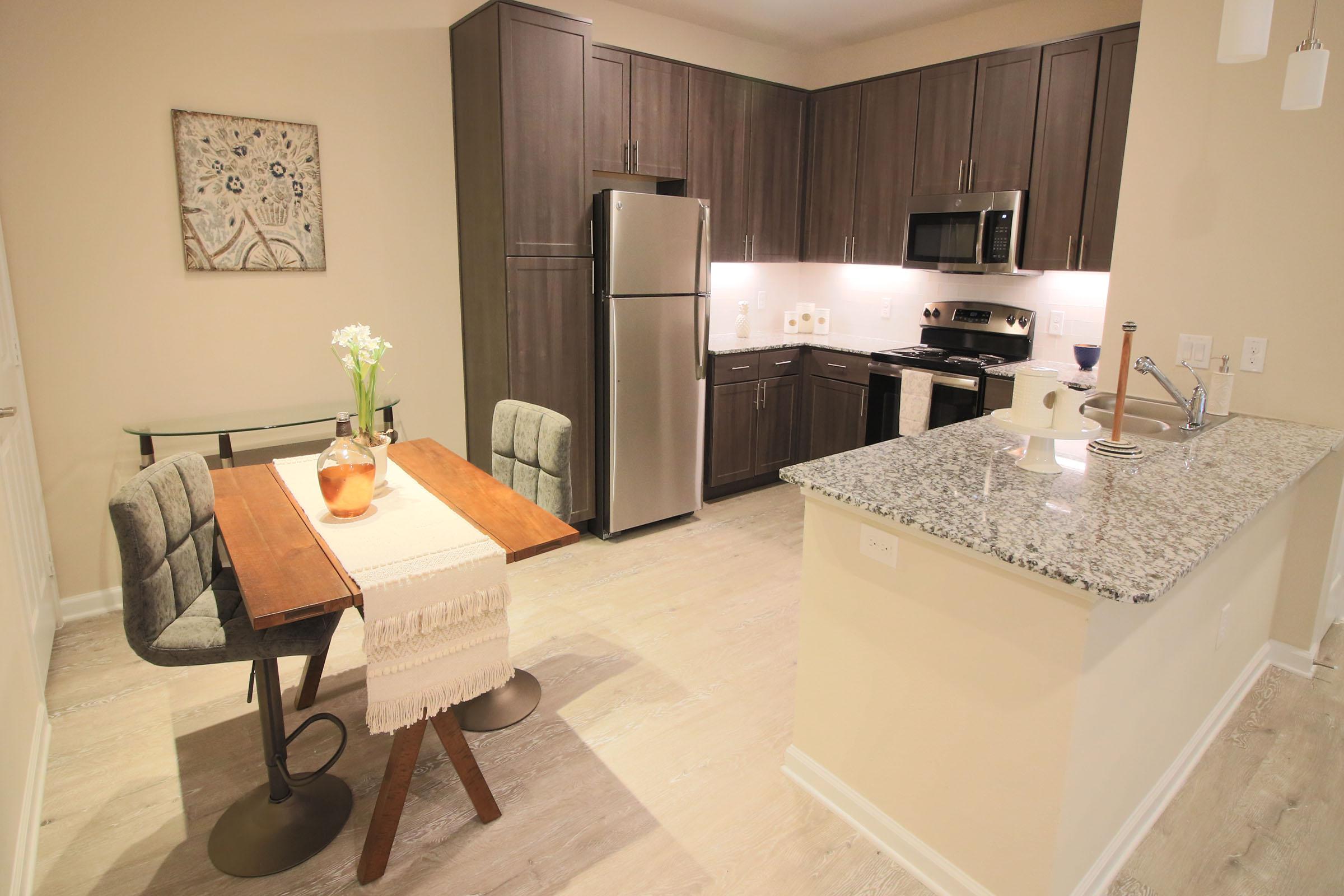 a kitchen with a sink and a mirror