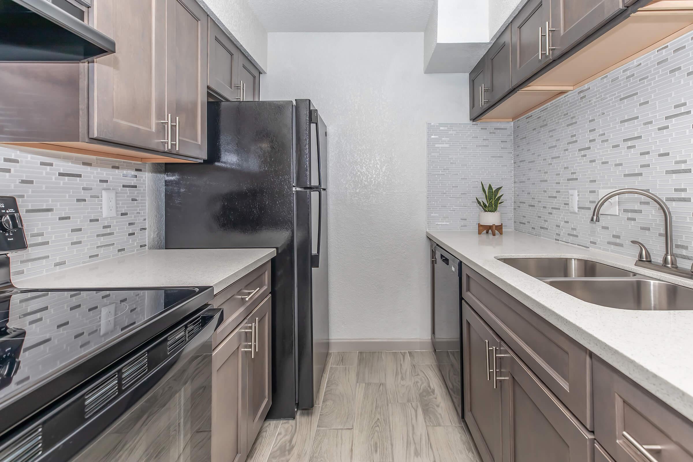 a large kitchen with stainless steel appliances