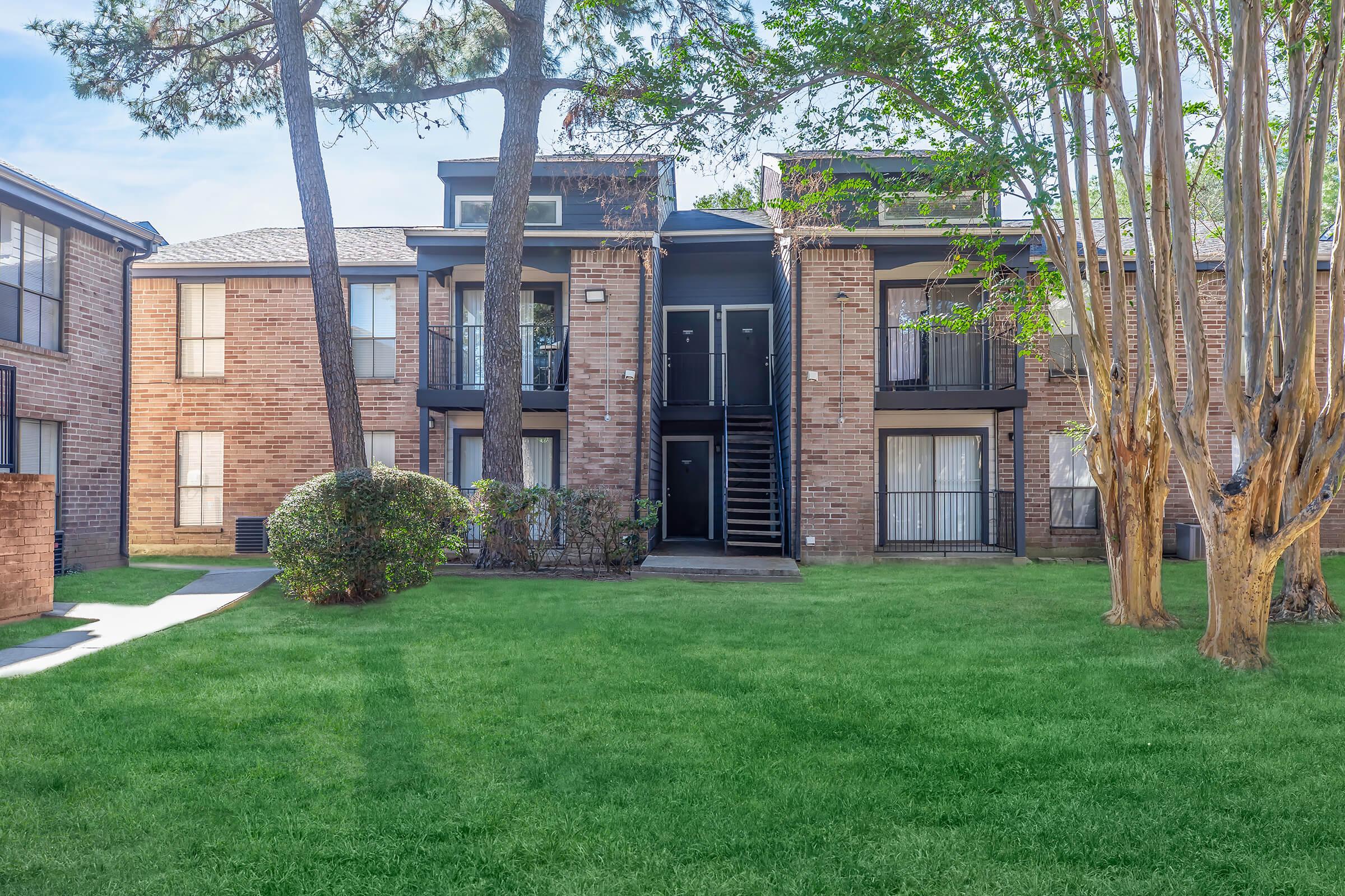 a large lawn in front of a house