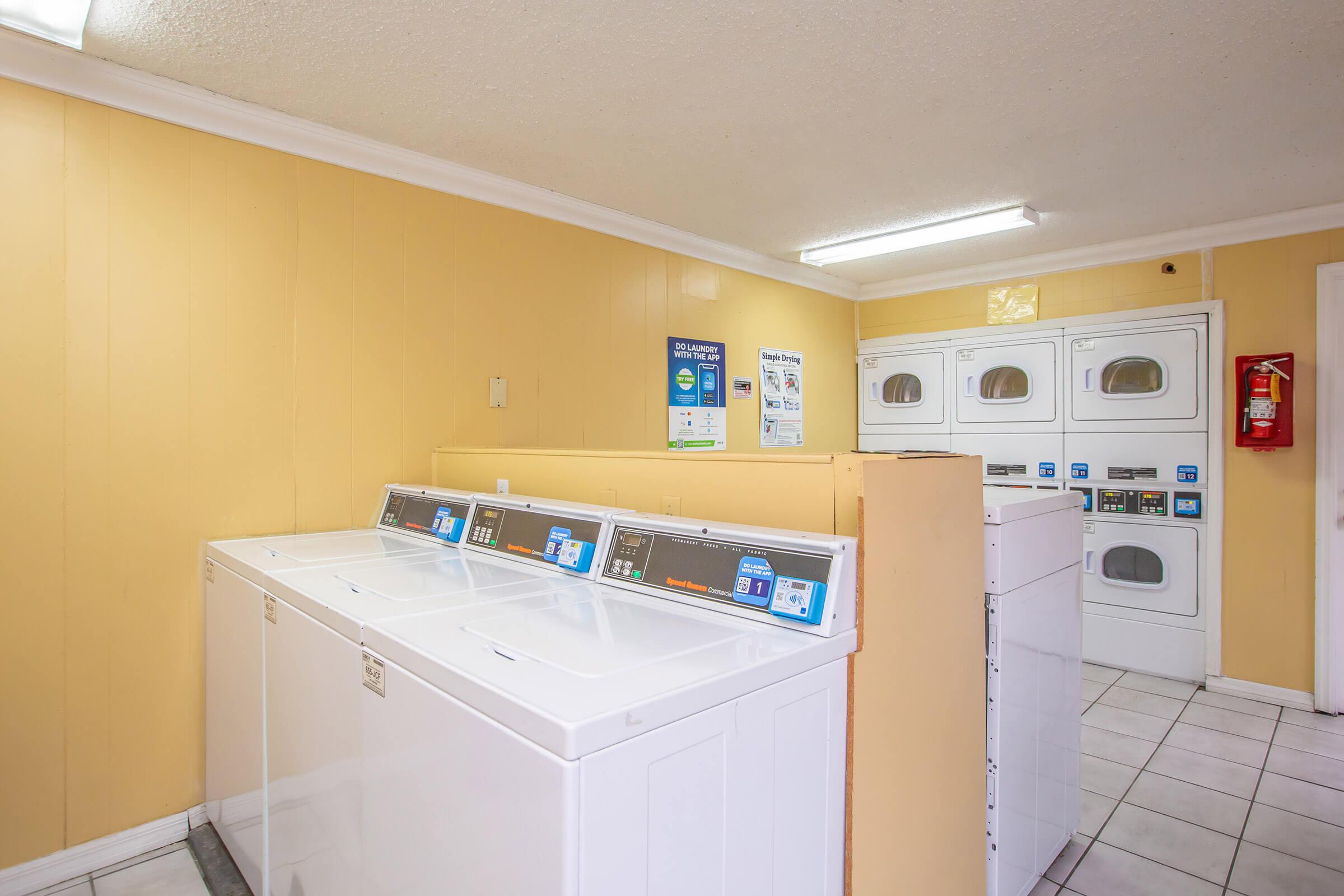 a kitchen with a refrigerator and a microwave