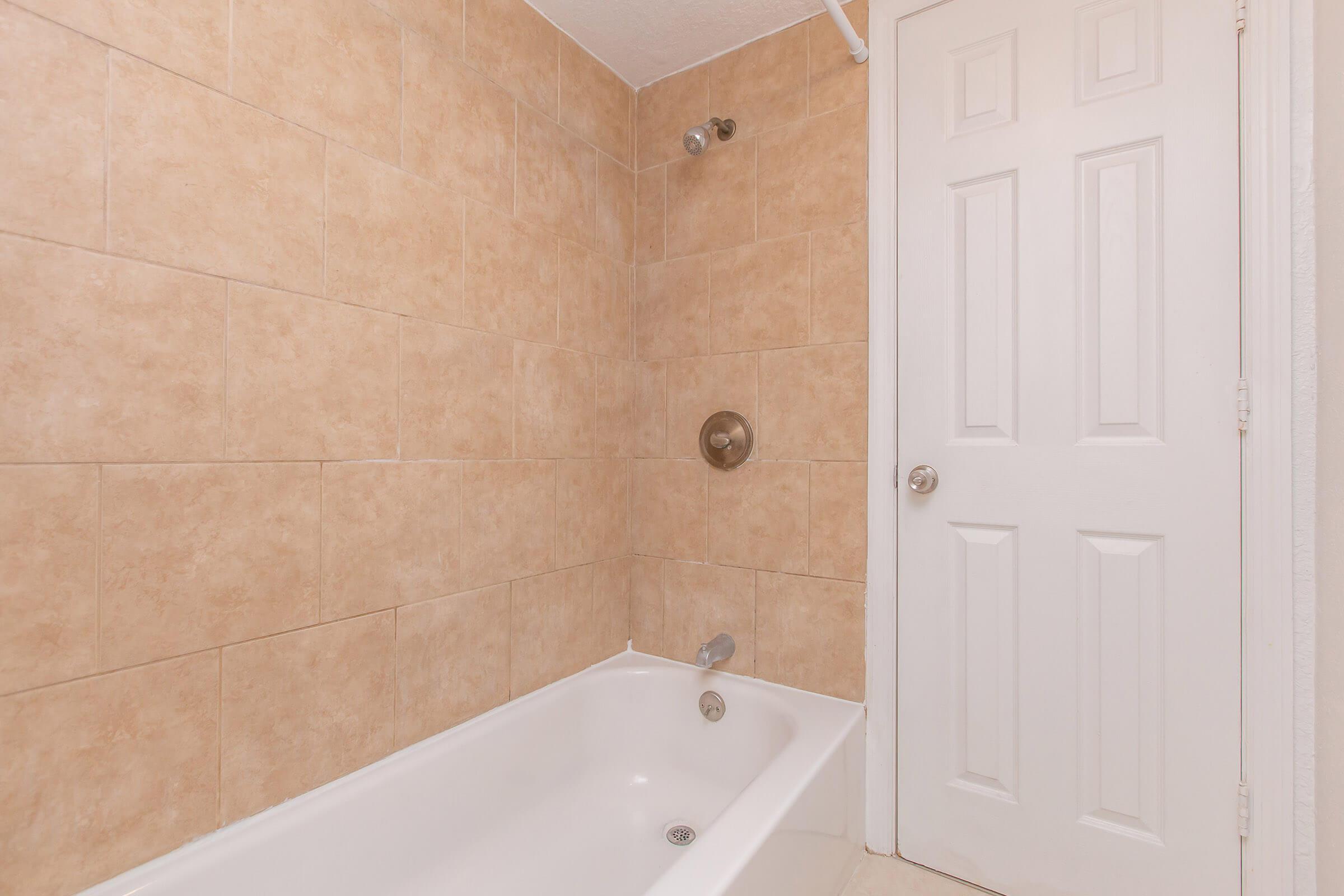 a close up of a sink and a bath tub