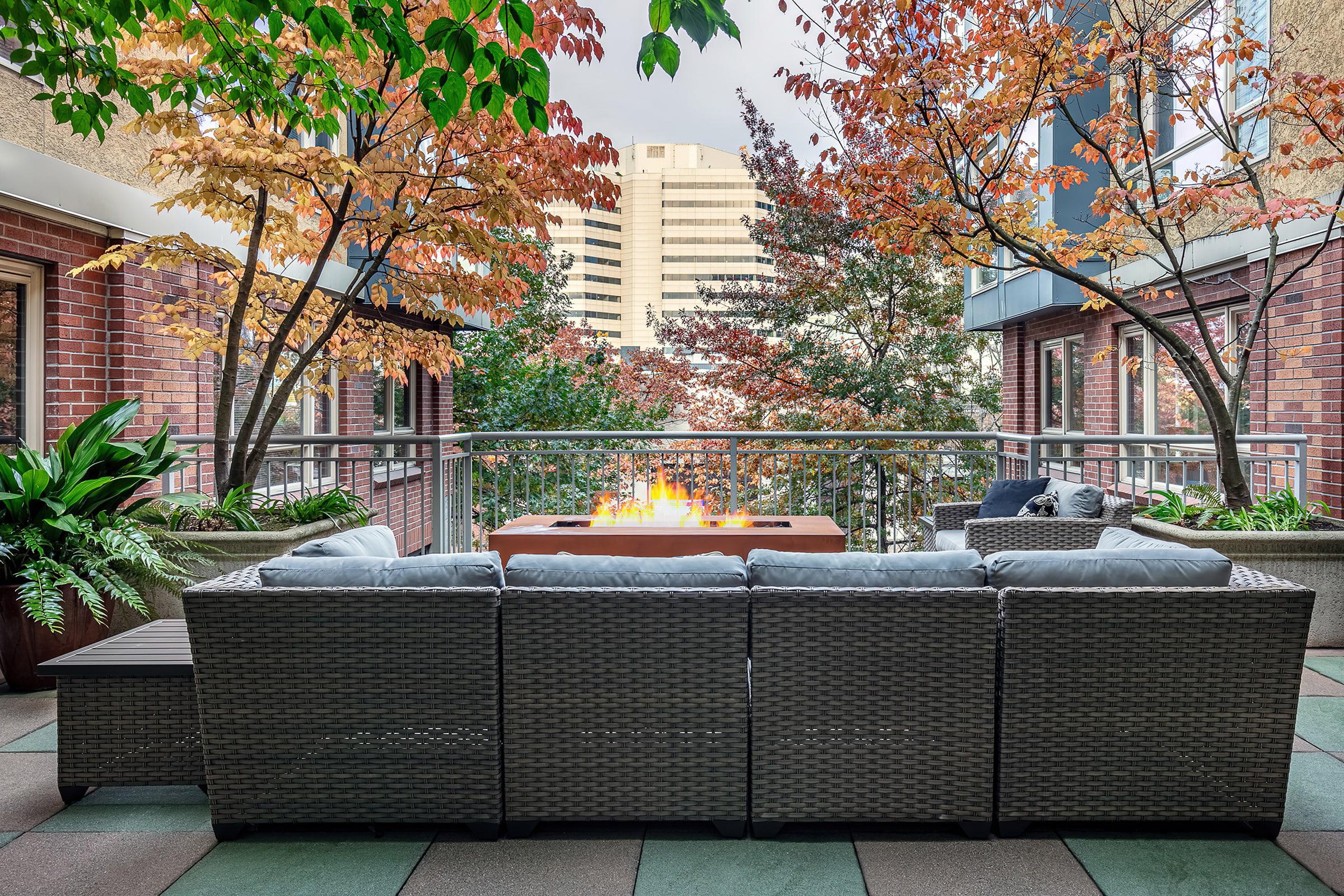 a bench in front of a brick building