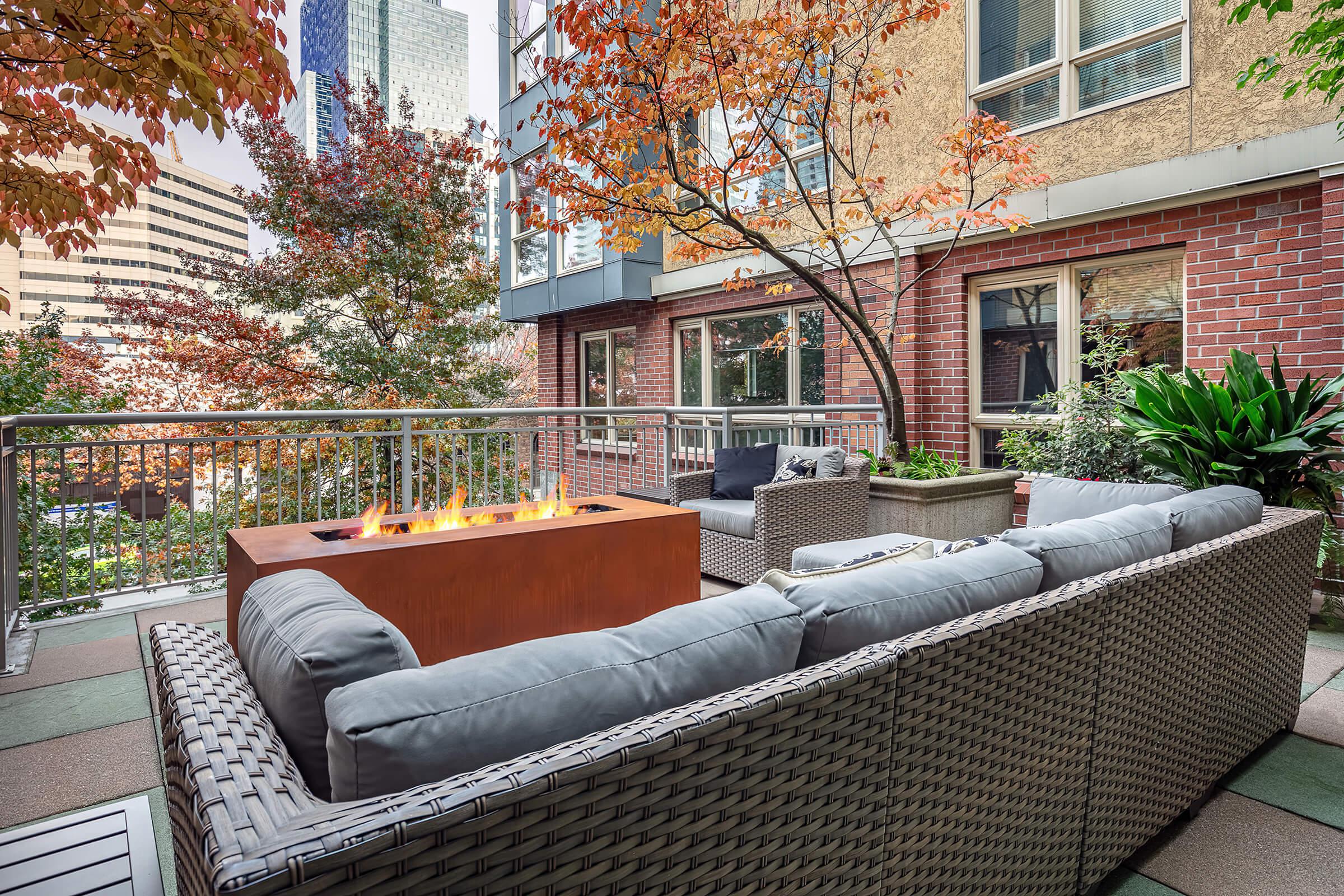 a chair sitting in front of a brick building